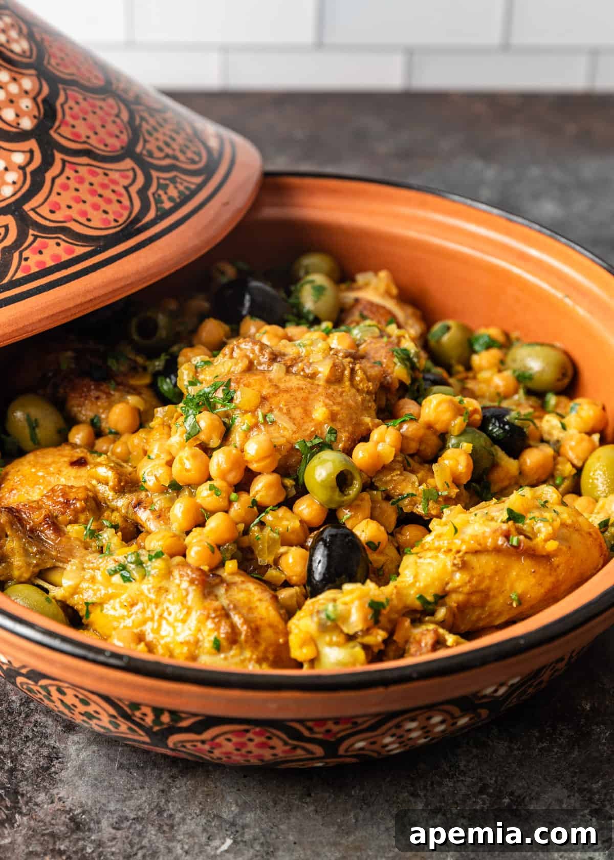 an array of vibrant spices, including cumin, coriander, paprika, and saffron, essential for creating authentic tagine flavors, displayed in small bowls