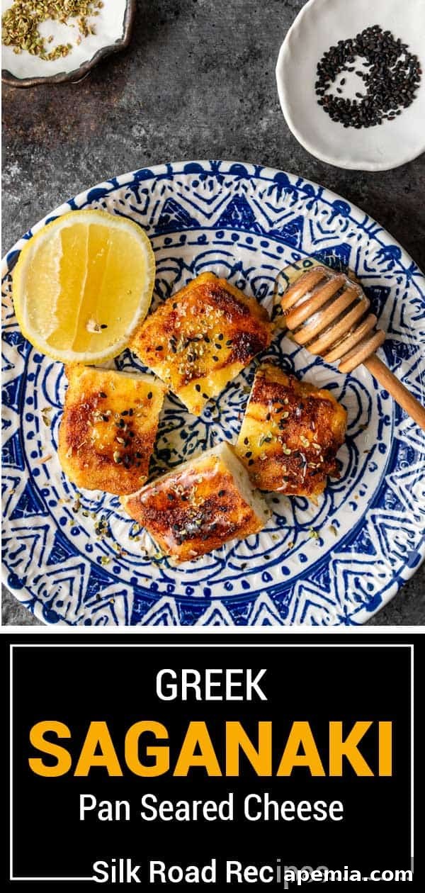 Fiery Greek Cheese Saganaki 11 Titled image displaying Greek Saganaki pan-seared cheese, garnished and ready to serve.