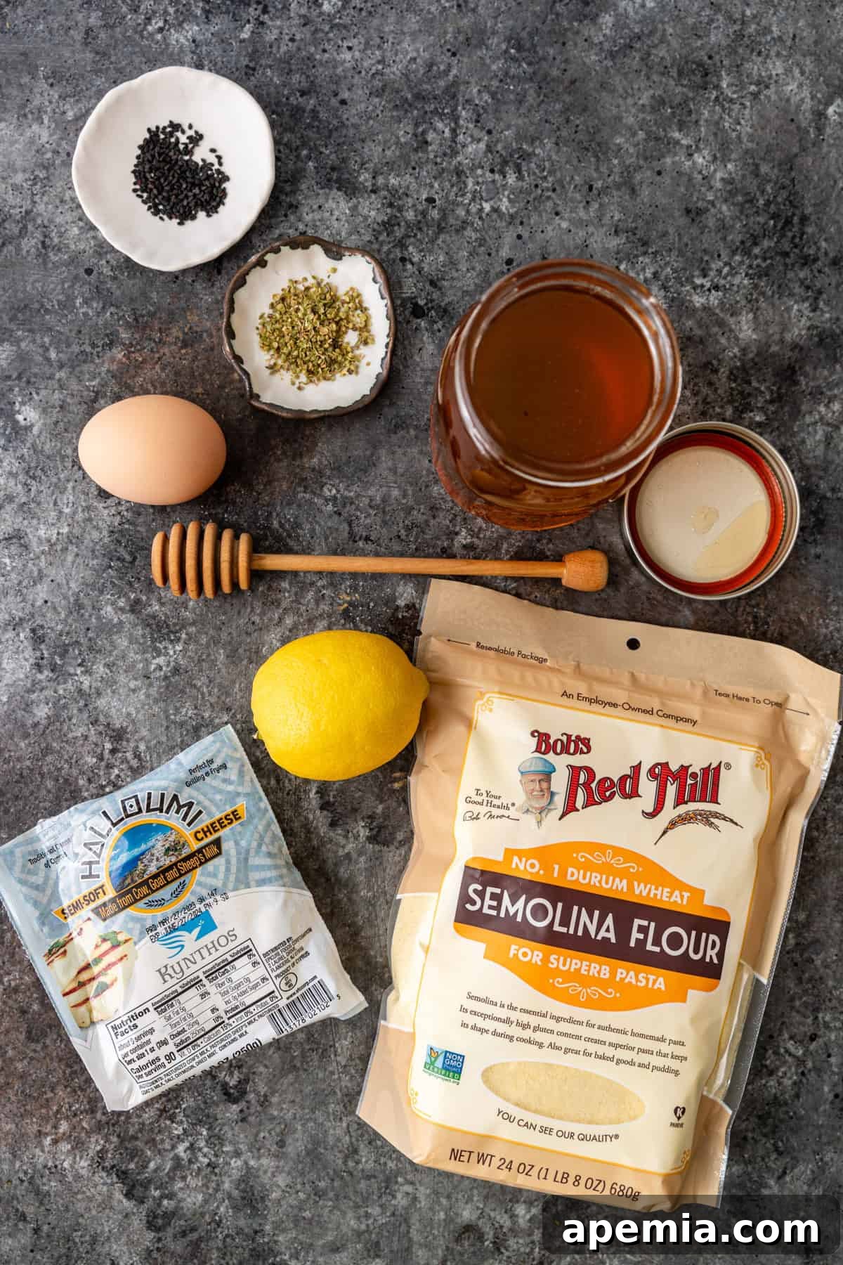 Fiery Greek Cheese Saganaki 4 Overhead shot of all ingredients required to prepare homemade Greek pan-seared cheese.