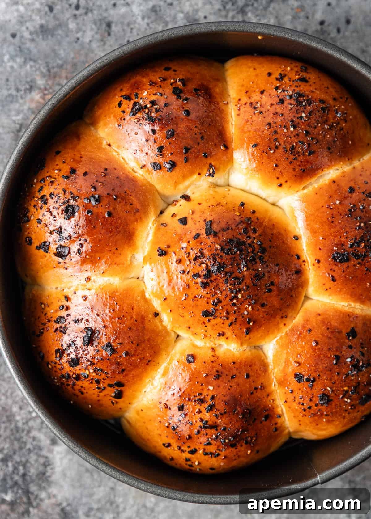 Overhead process shot: Japanese milk bread rolls, freshly baked and ready to enjoy.
