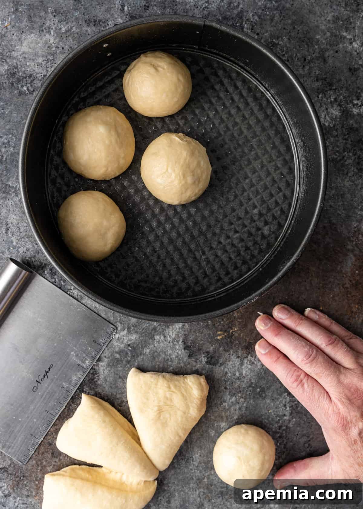 Overhead process shot: Rolling the dough into smooth, individual balls.