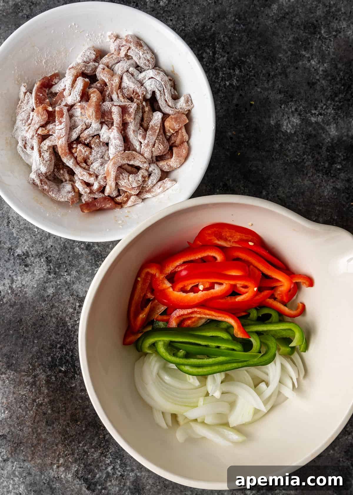 overhead: prepared pork and sliced bell peppers and onions for my vinegar pork stir fry recipe