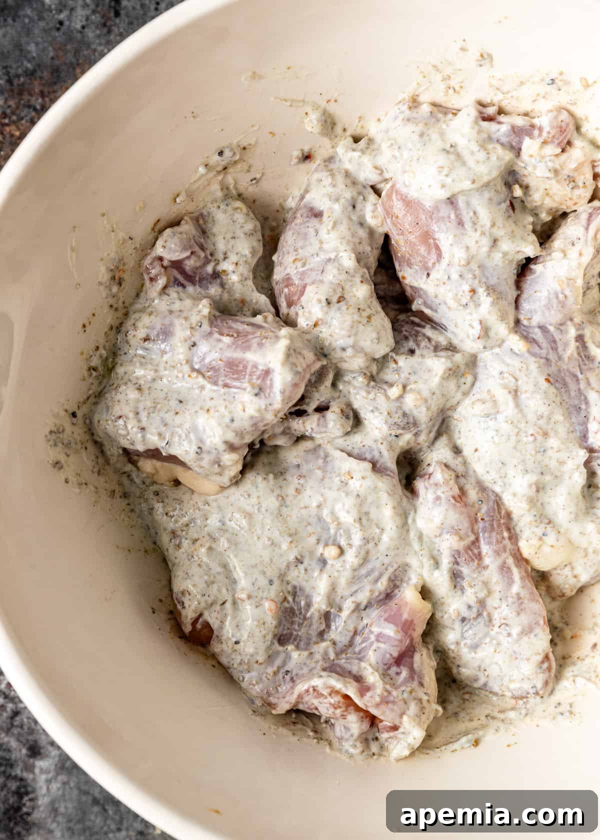 chicken marinating in yogurt and spices