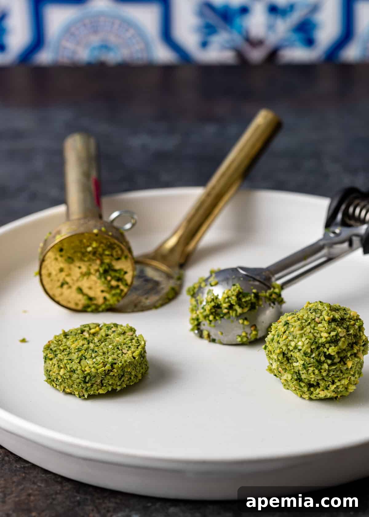 using a falafel scoop and cookie scoop to shape Egyptian falafel balls