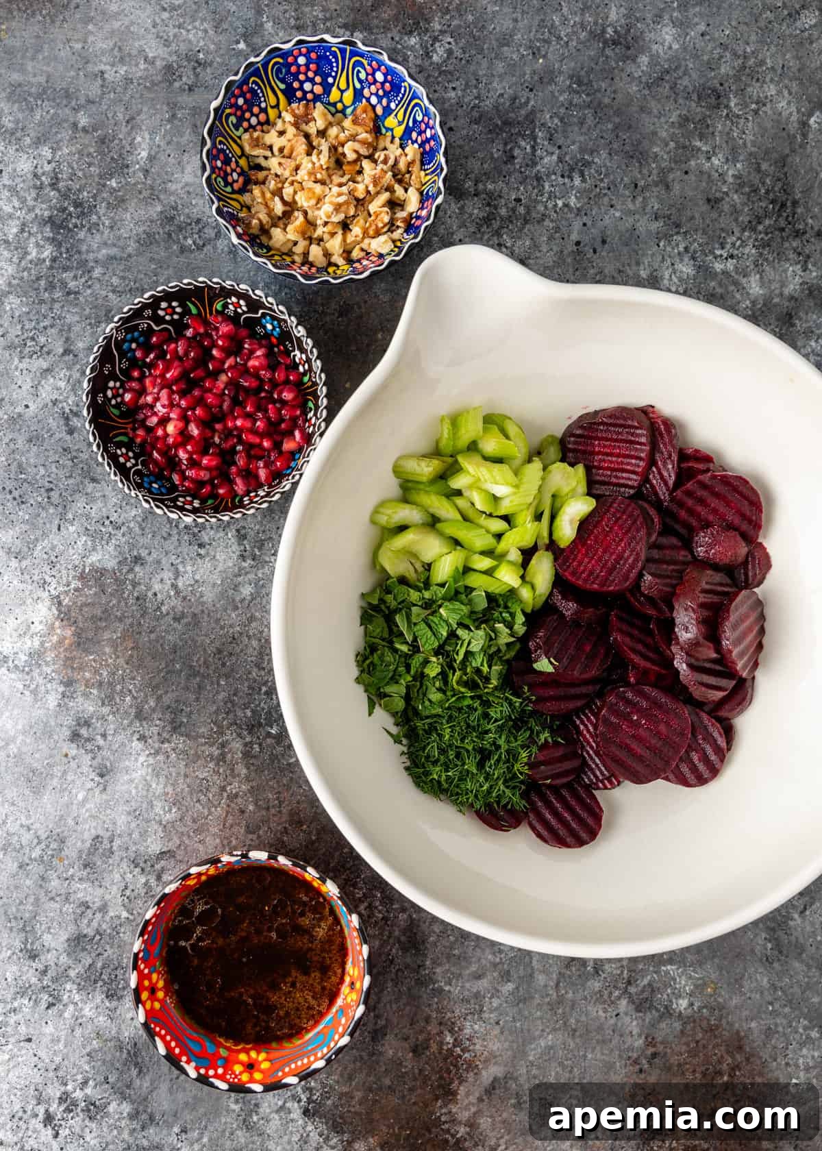 Vibrant Turkish Beet Salad 6 overhead: a bowl containing all prepared ingredients for Cevizli Pancar, beautifully mixed and ready for dressing