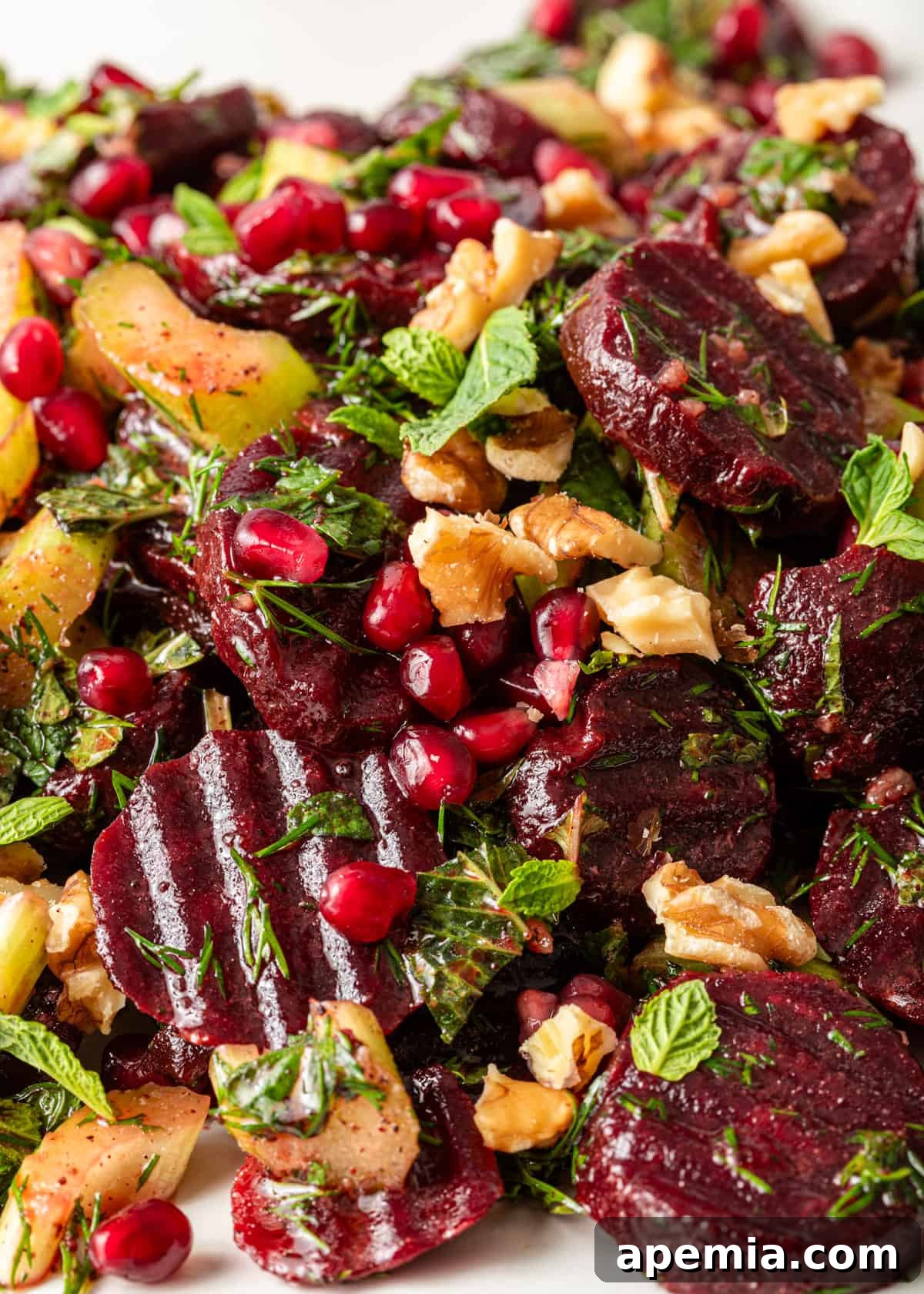 Vibrant Turkish Beet Salad 8 extreme closeup: my Turkish beet salad recipe, emphasizing the intricate blend of fresh herbs, walnuts, and glistening beets under the dressing