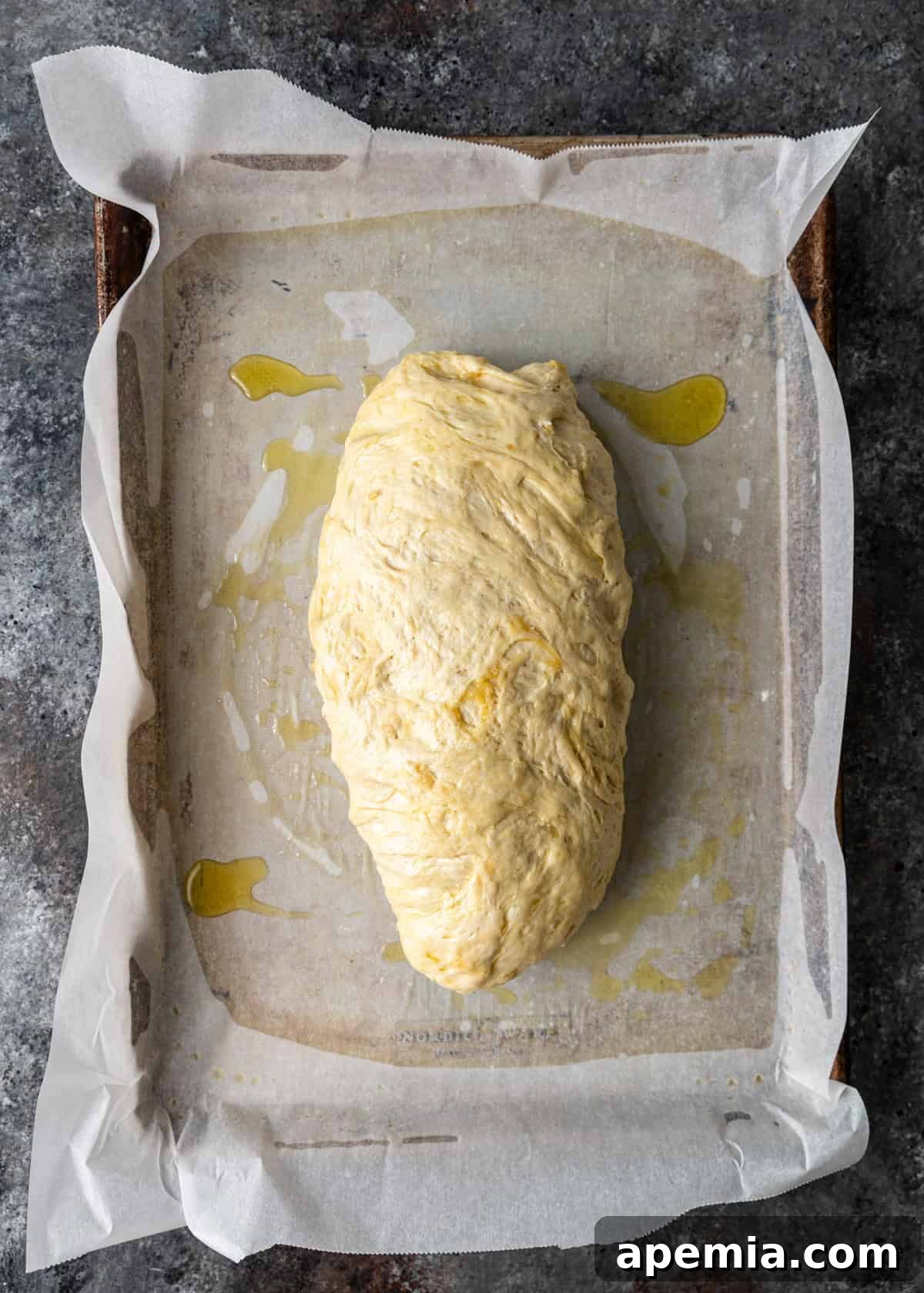 overhead process shot: dough turned and flipped so the seam is down