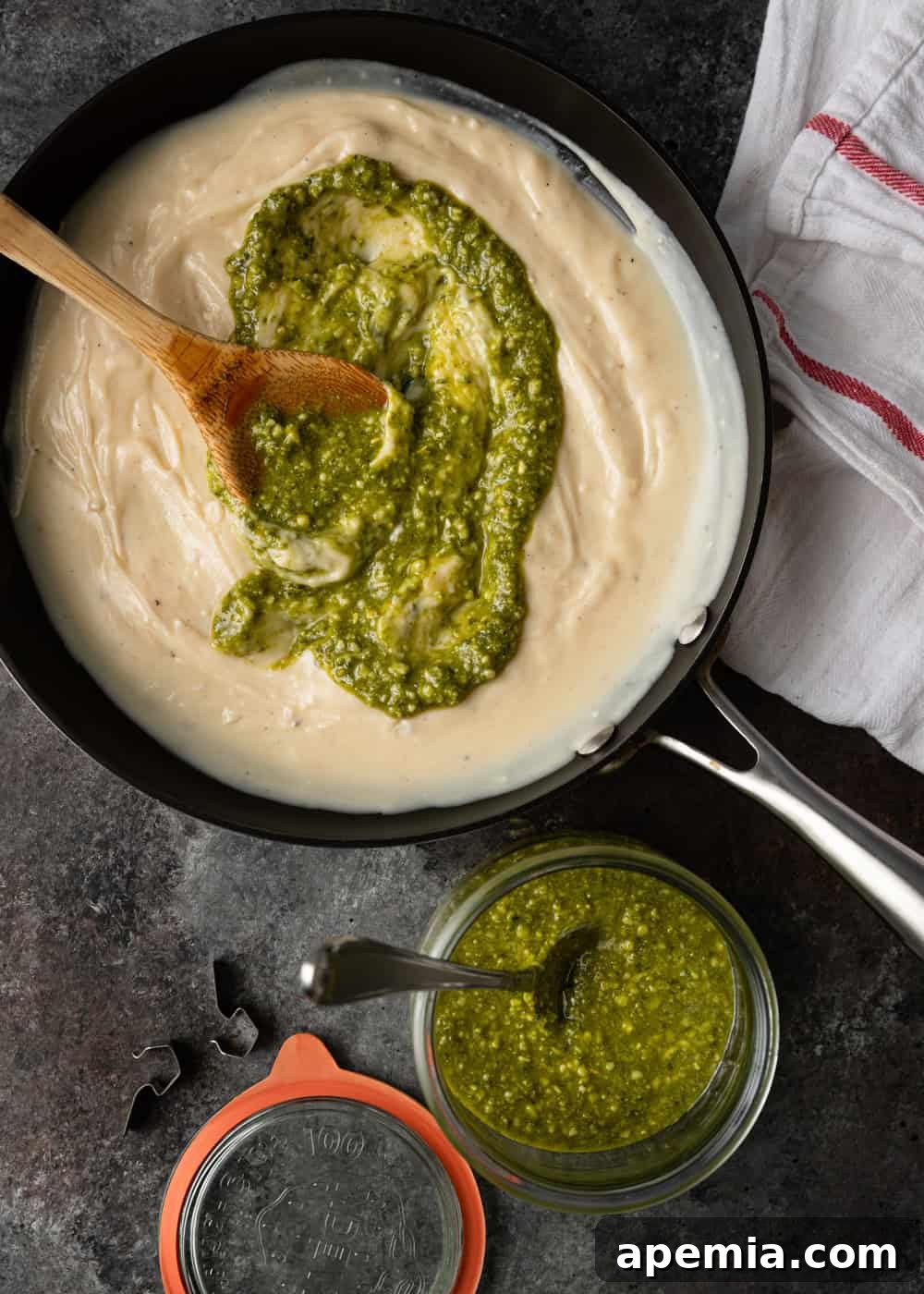 swirl of pesto in alfredo sauce