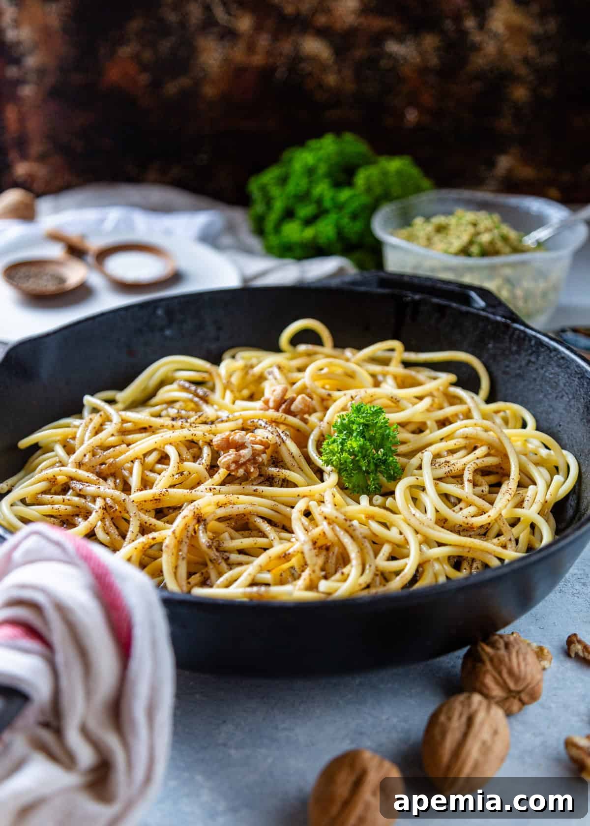 golden brown butter bucatini glistening in a cast iron skillet, ready to serve
