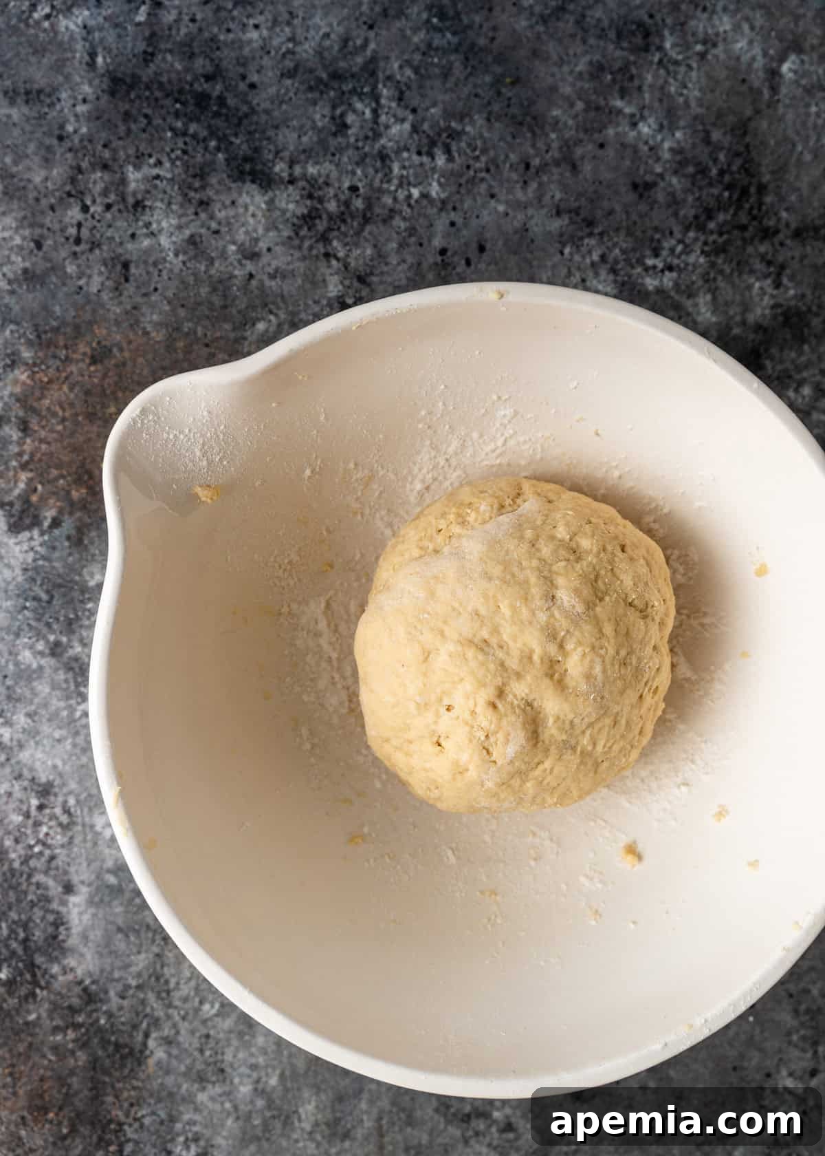 Overhead process shot: A perfectly smooth, rested dough ball, ready to be rolled for the Manti recipe.