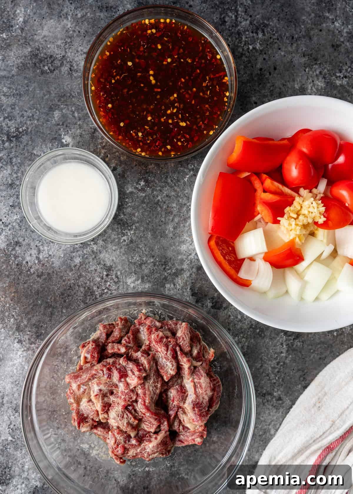 Sweet & Tangy Beijing Beef 4 Overhead view of all the fresh ingredients laid out for the Beijing Beef recipe, ready for preparation