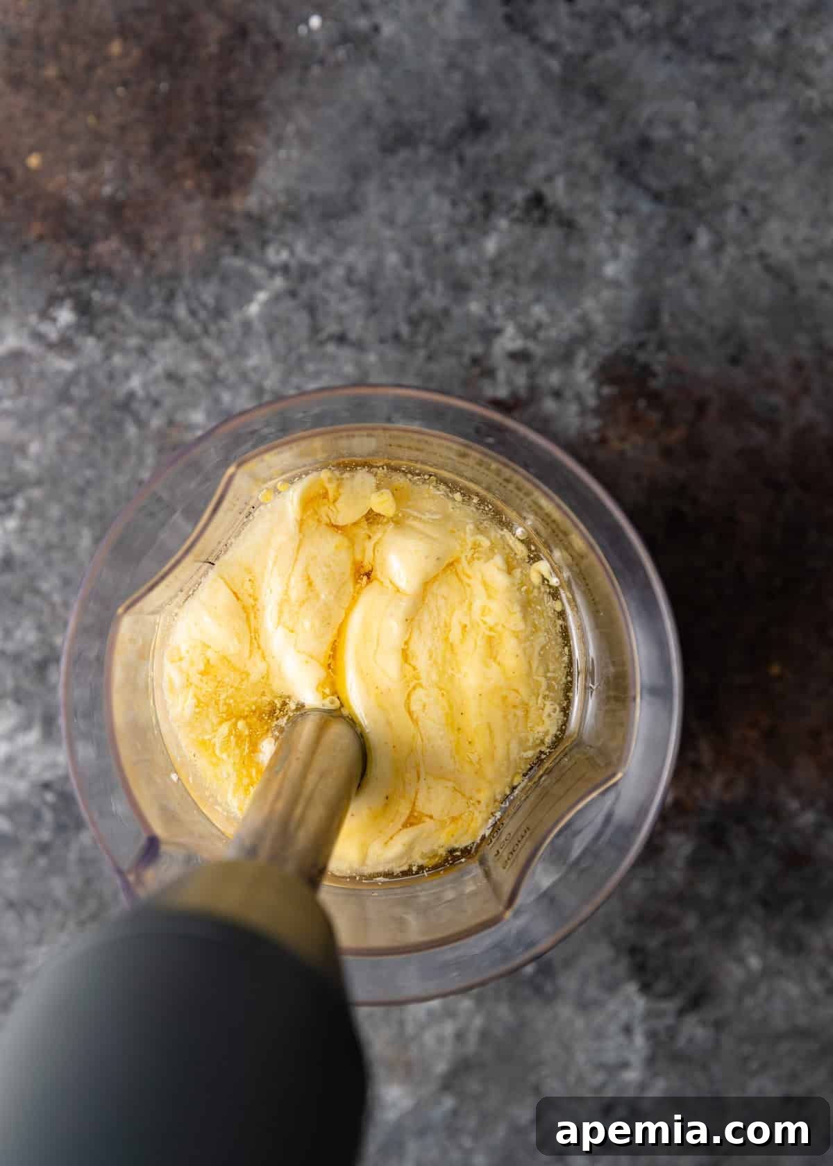 overhead process shot: blending mayo in immersion blender after blending a bit