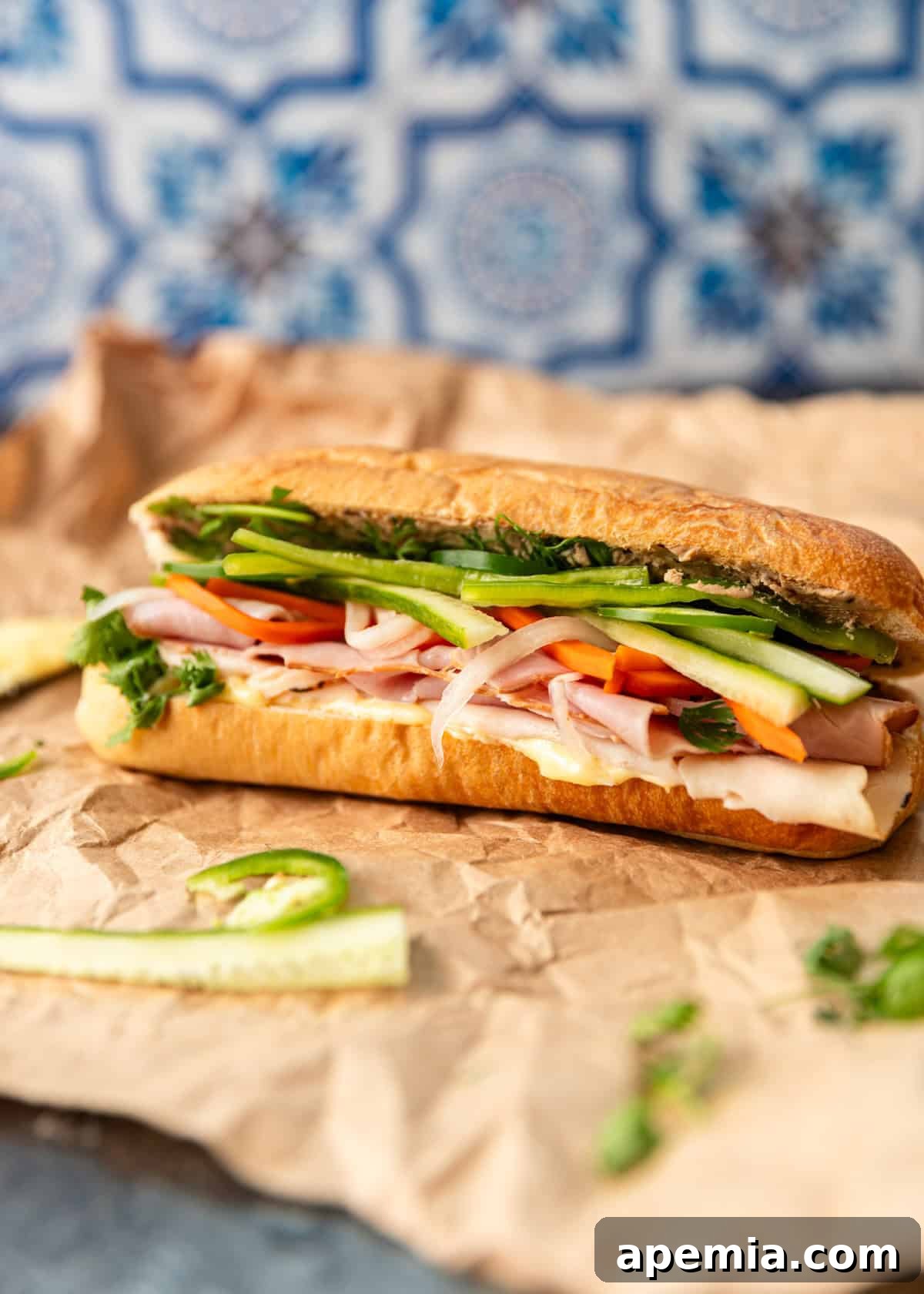 side view: a banh mi sandwich loaded with fresh fillings