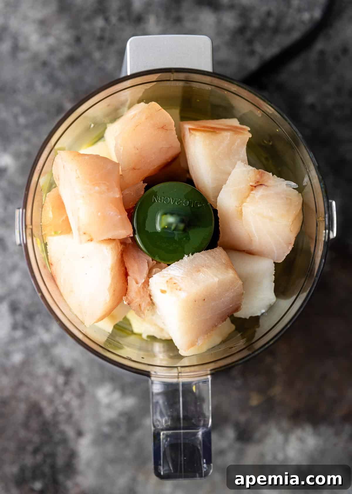 overhead process shot: fish pieces in a blender