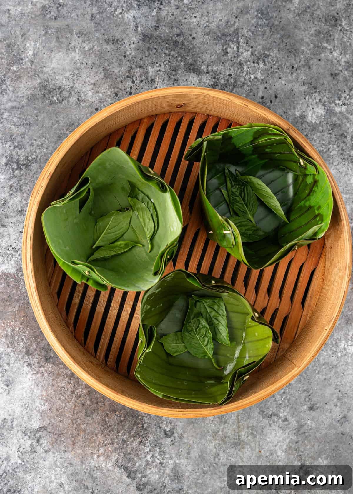 overhead process shot: thai basil in bowls