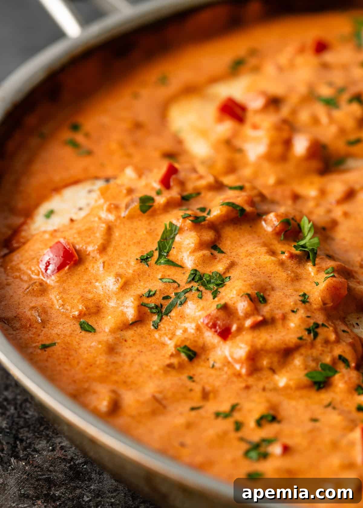 Creamy Hungarian Chicken Delight 11 closeup: chicken paprikash with red bell pepper in sauce showing
