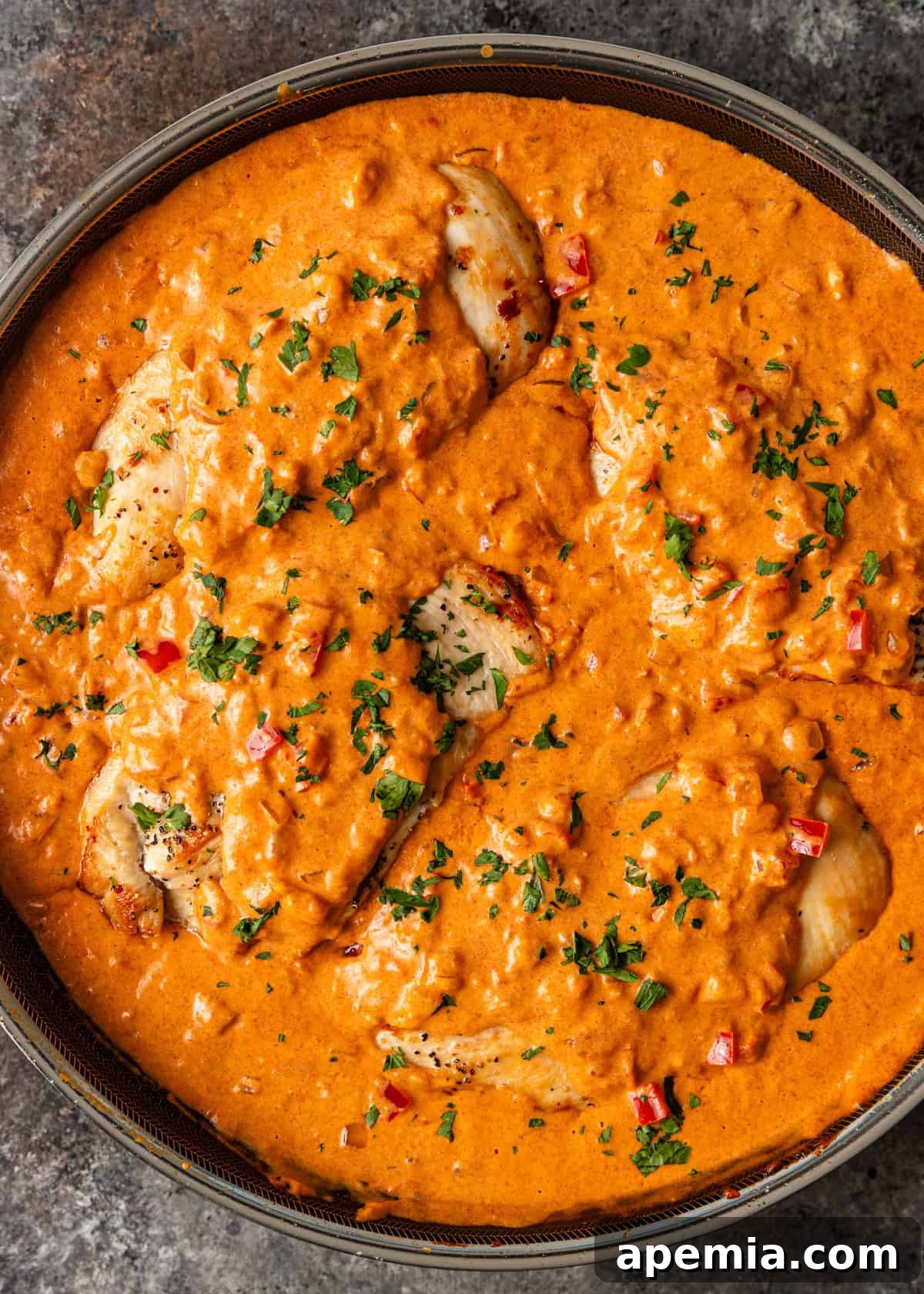 Creamy Hungarian Chicken Delight 12 overhead: my chicken paprikash recipe in a skillet with creamy sauce and fresh parsley on top