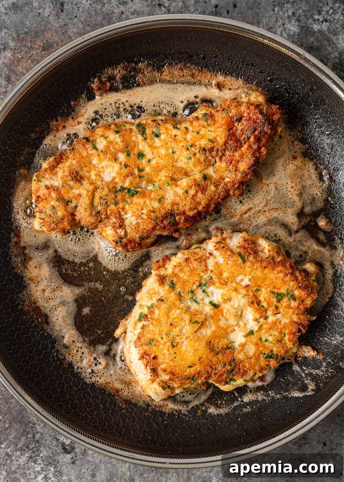 overhead: cooking my chicken francese recipe in a skillet