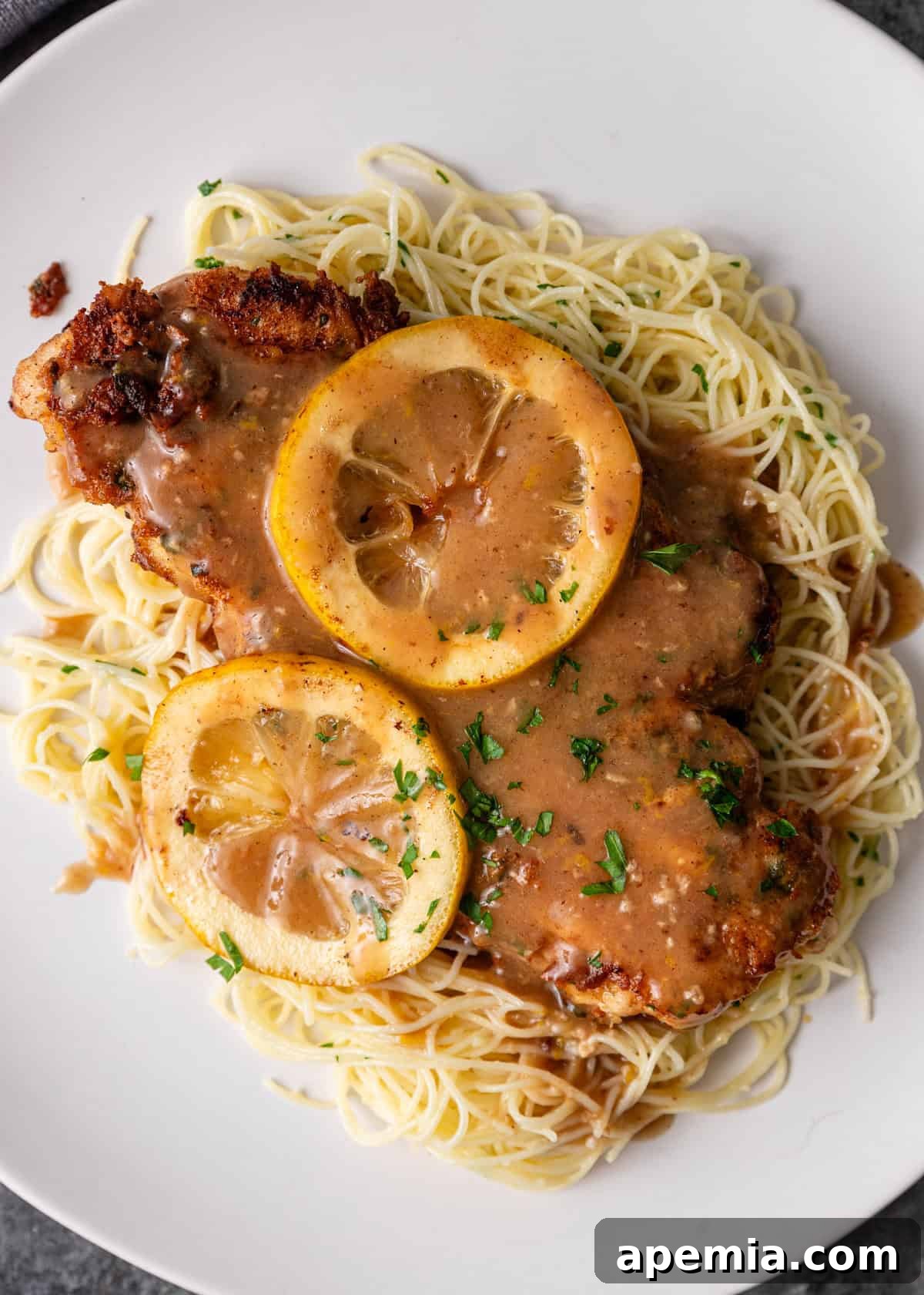 overhead: my chicken francese recipe over angel hair pasta