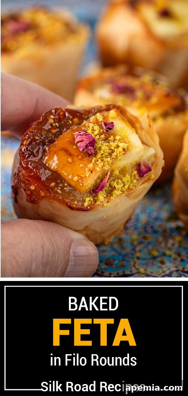 Large titled image showcasing the finished baked feta in filo rounds with honey and pistachios.