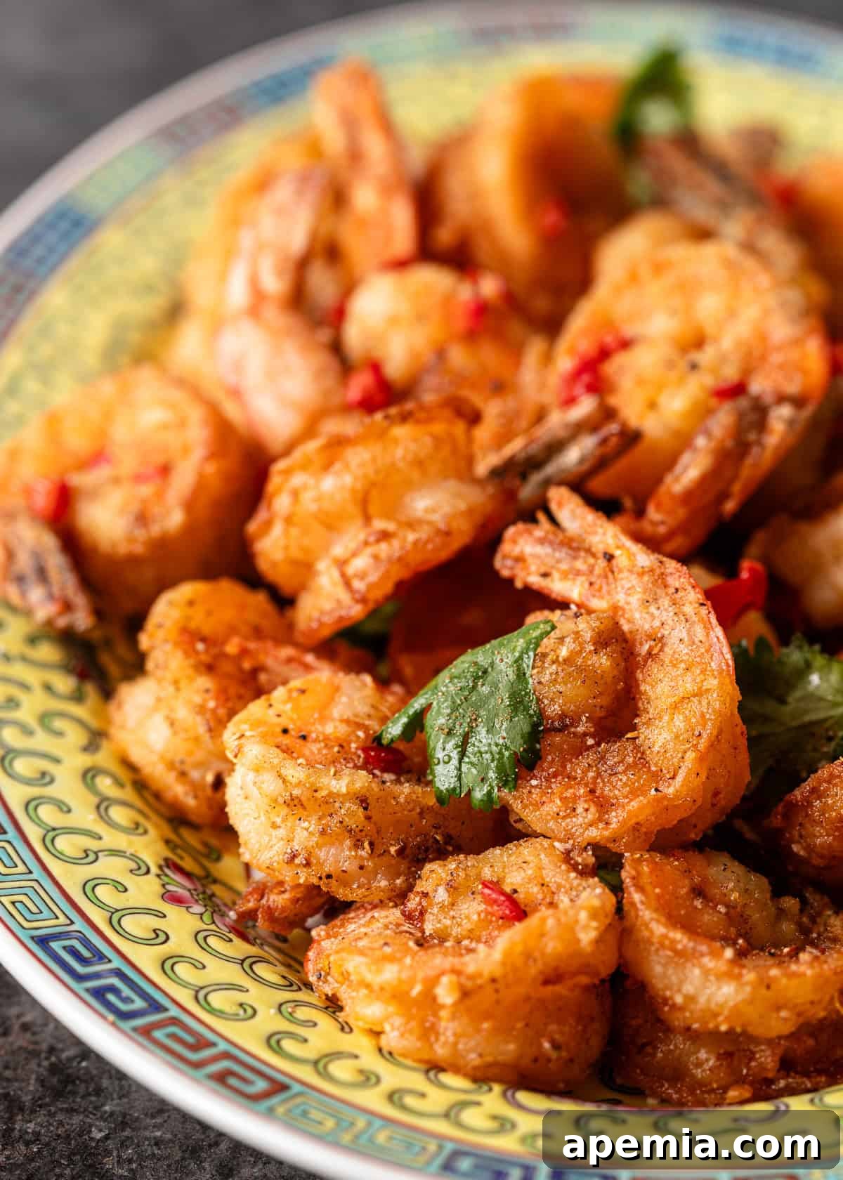 closeup: salt and pepper shrimp with chiles and seasonings