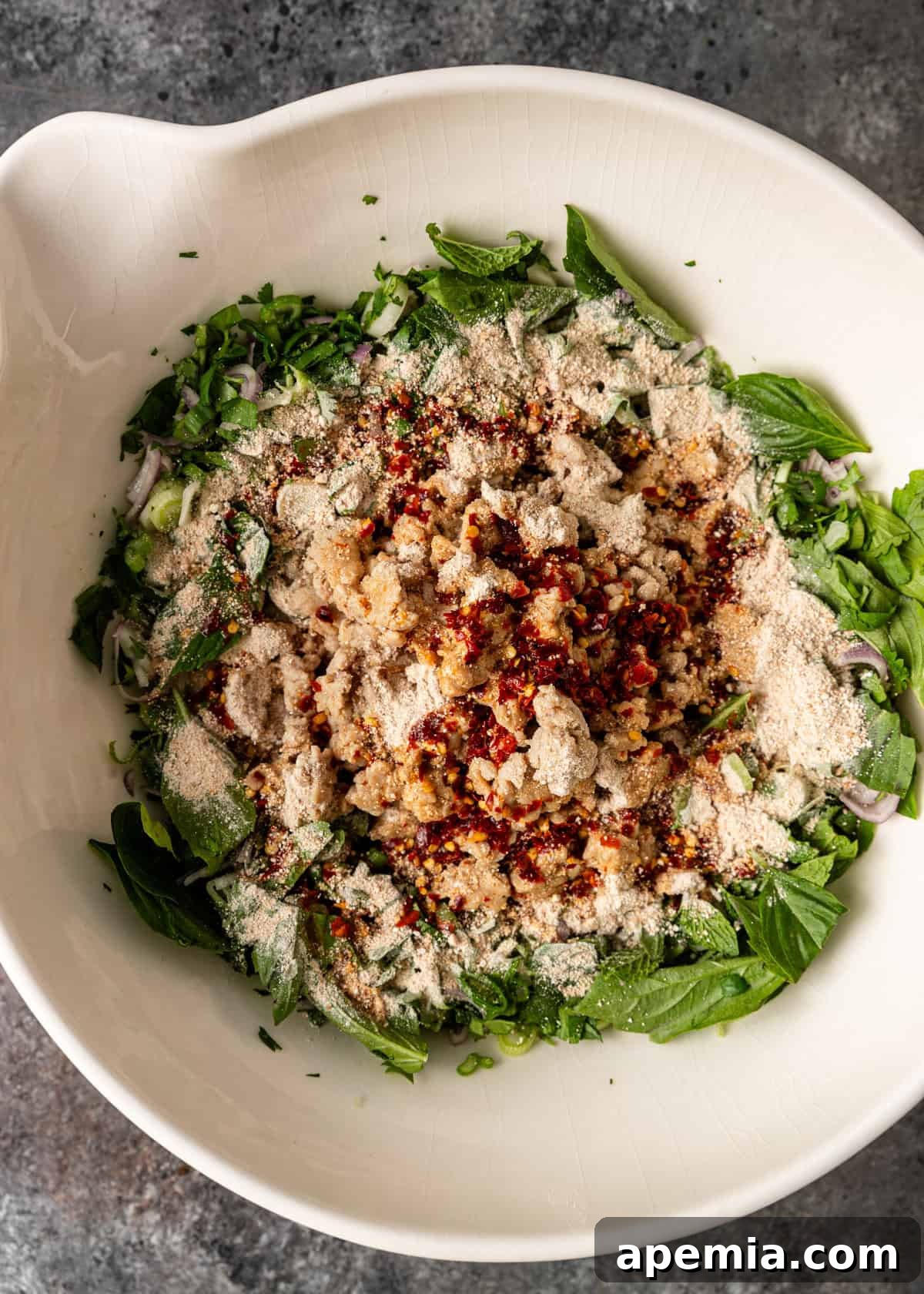 Zesty Thai Larb Gai Chicken Lettuce Wraps 11 overhead process shot: larb gai recipe ingredients in a large mixing bowl before mixing