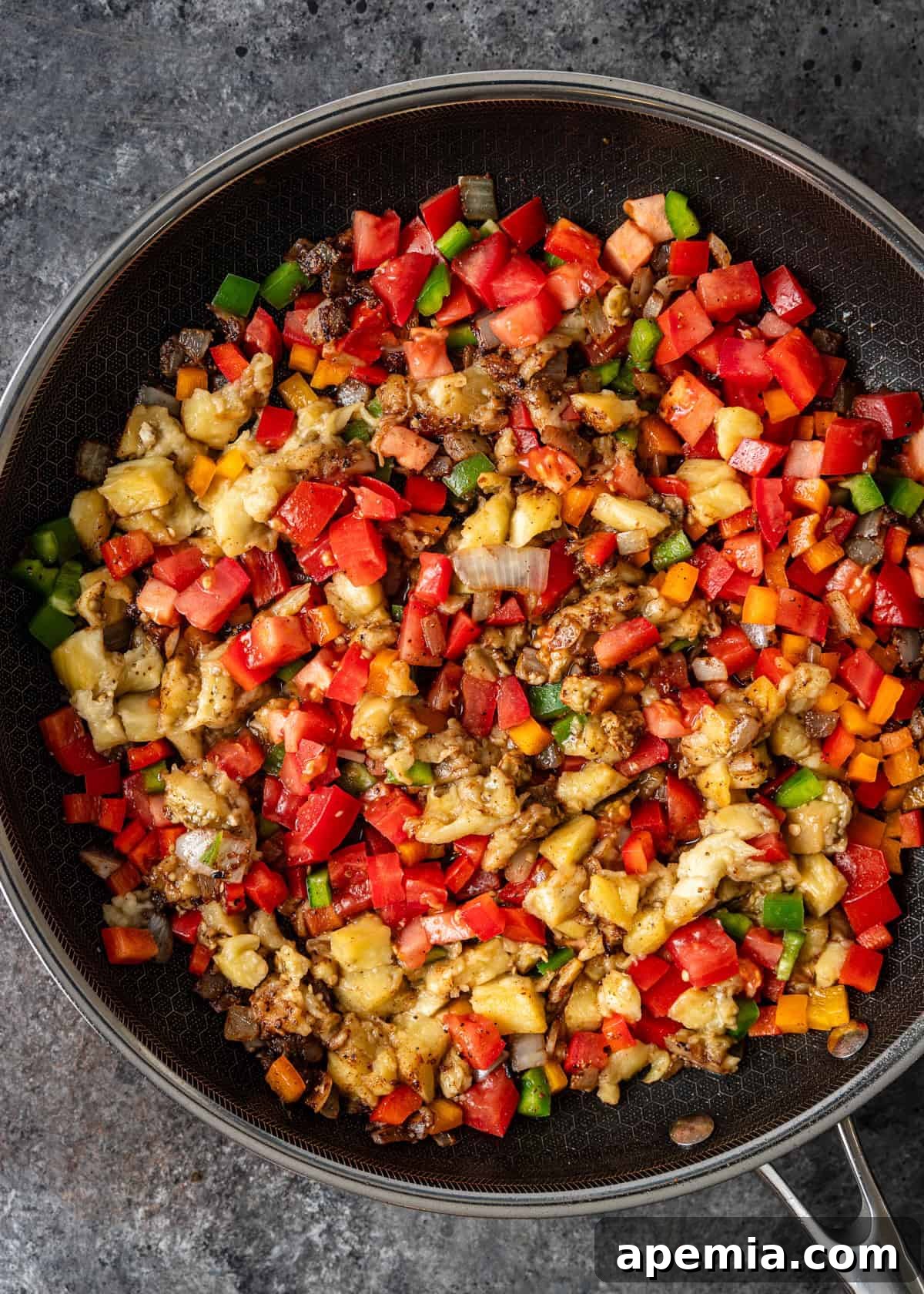 overhead: chopped vegetables in a sauté pan