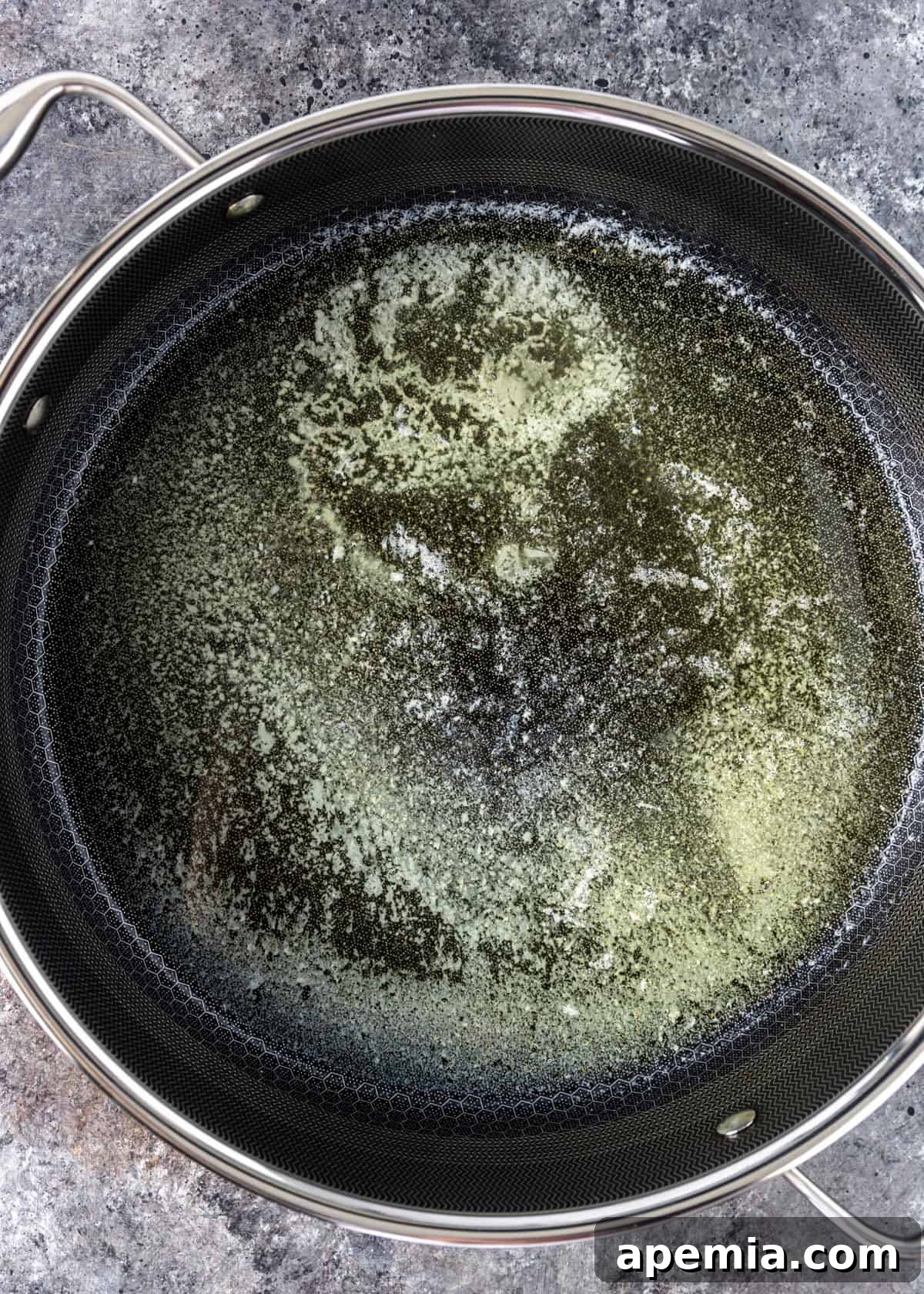 overhead process shot: melting butter in a skillet