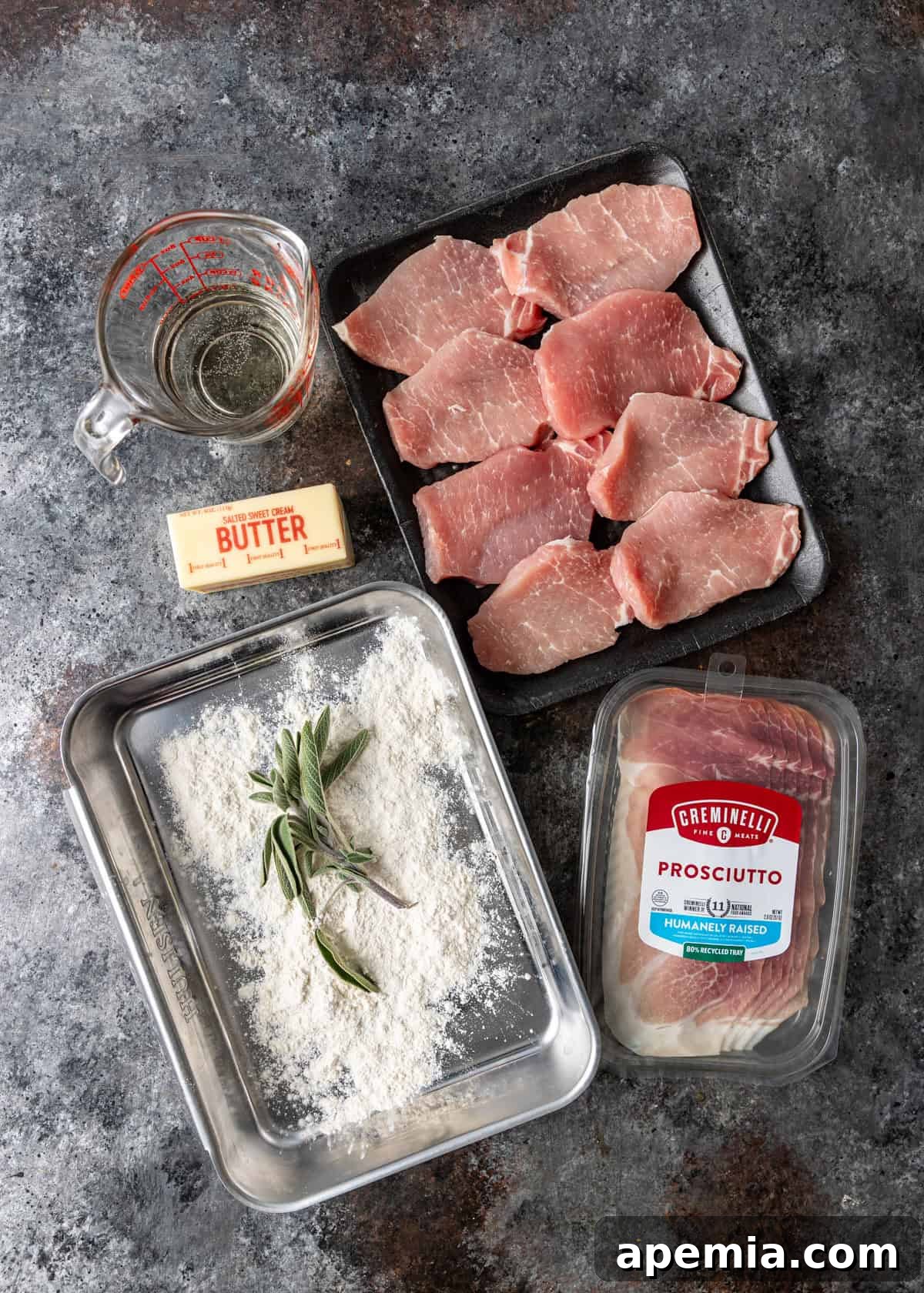 An overhead shot displaying all the fresh ingredients required to make delicious pork saltimbocca.
