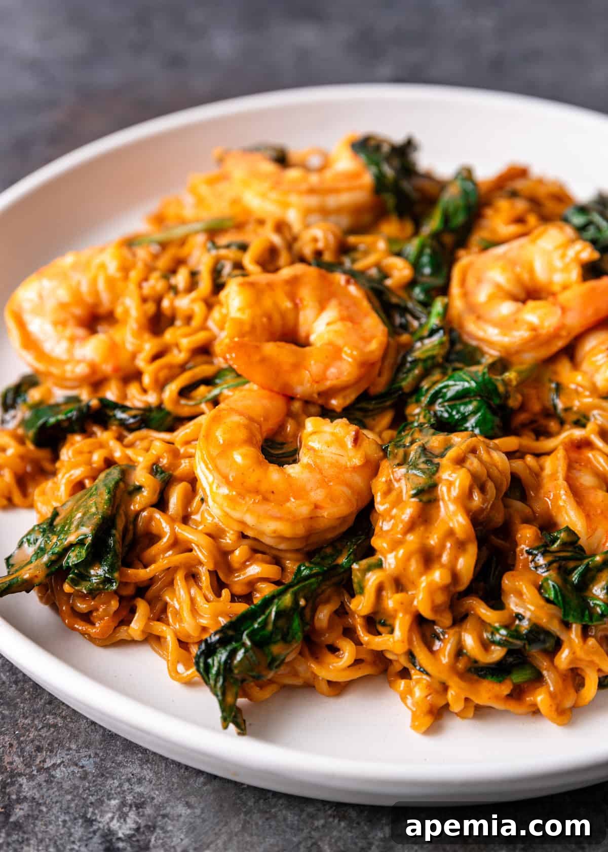 Zesty Gochujang Sesame Noodles 9 closeup: saucy gochujang noodles with spinach and shrimp