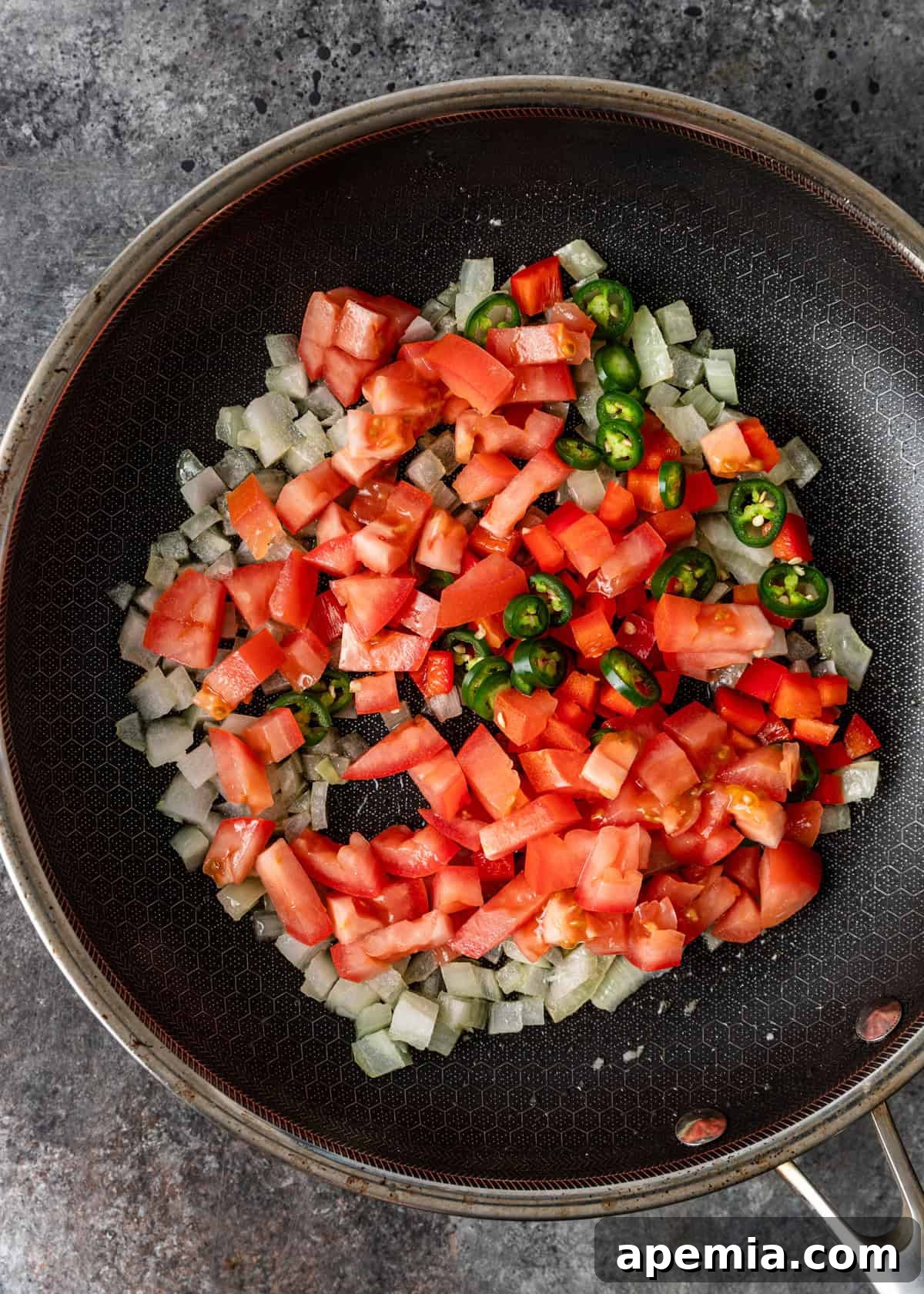 Menemen Classic Turkish Breakfast Scramble 5 Overhead process shot: neatly chopped vegetables in a skillet, ready for cooking.