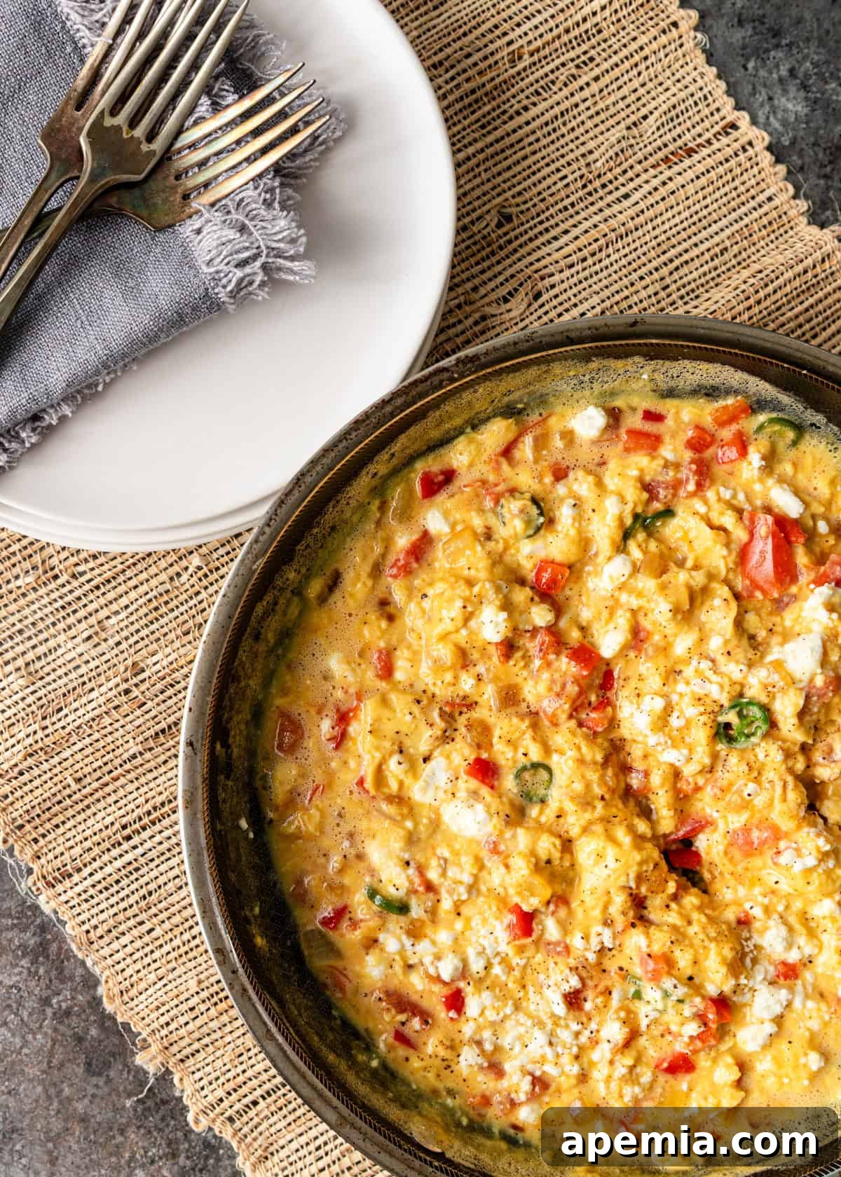 Menemen Classic Turkish Breakfast Scramble 6 Overhead shot of a skillet of menemen, featuring rich tomato sauce, creamy feta, and perfectly cooked eggs.