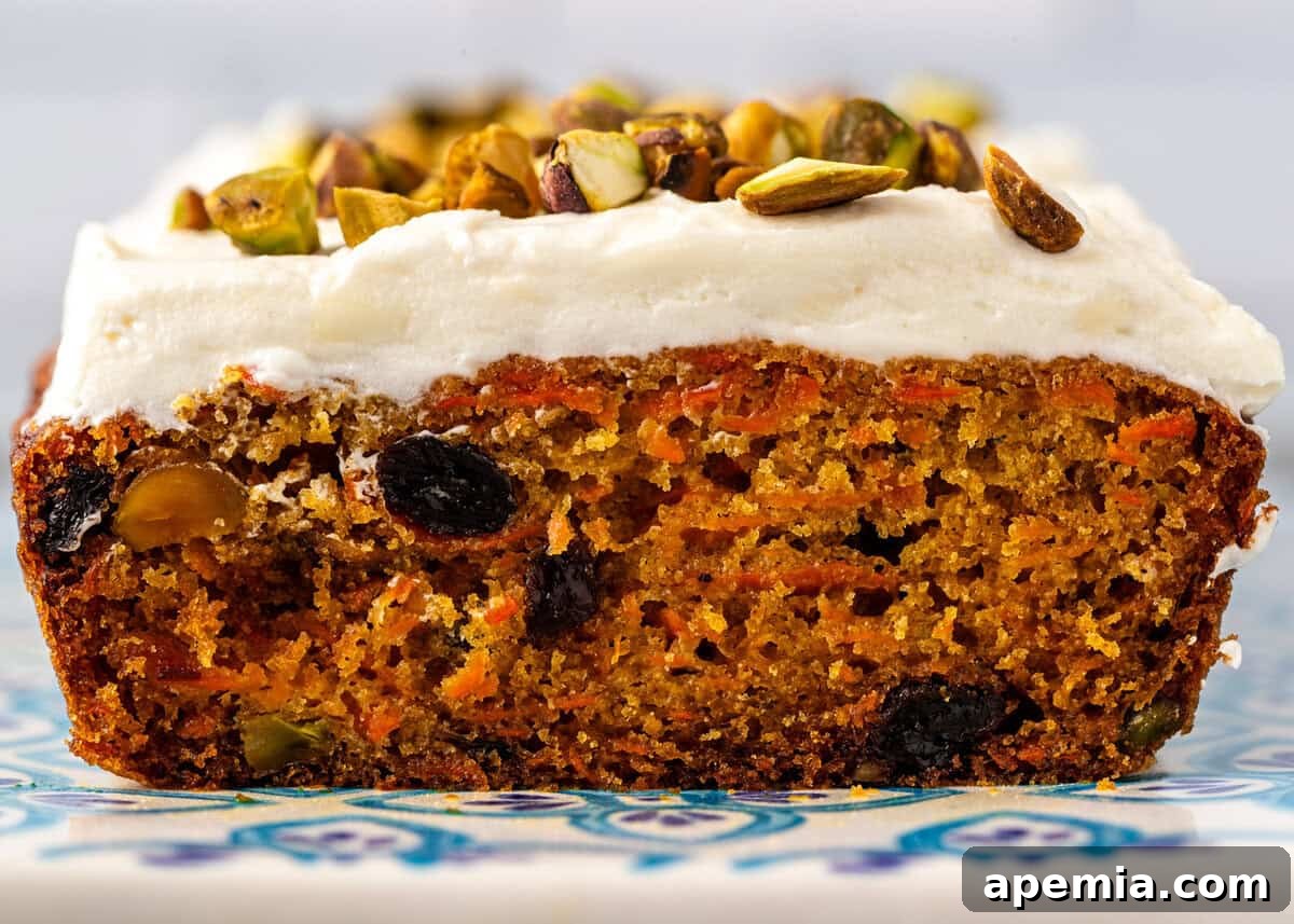 side view: carrot cake loaf with a slice removed to show center