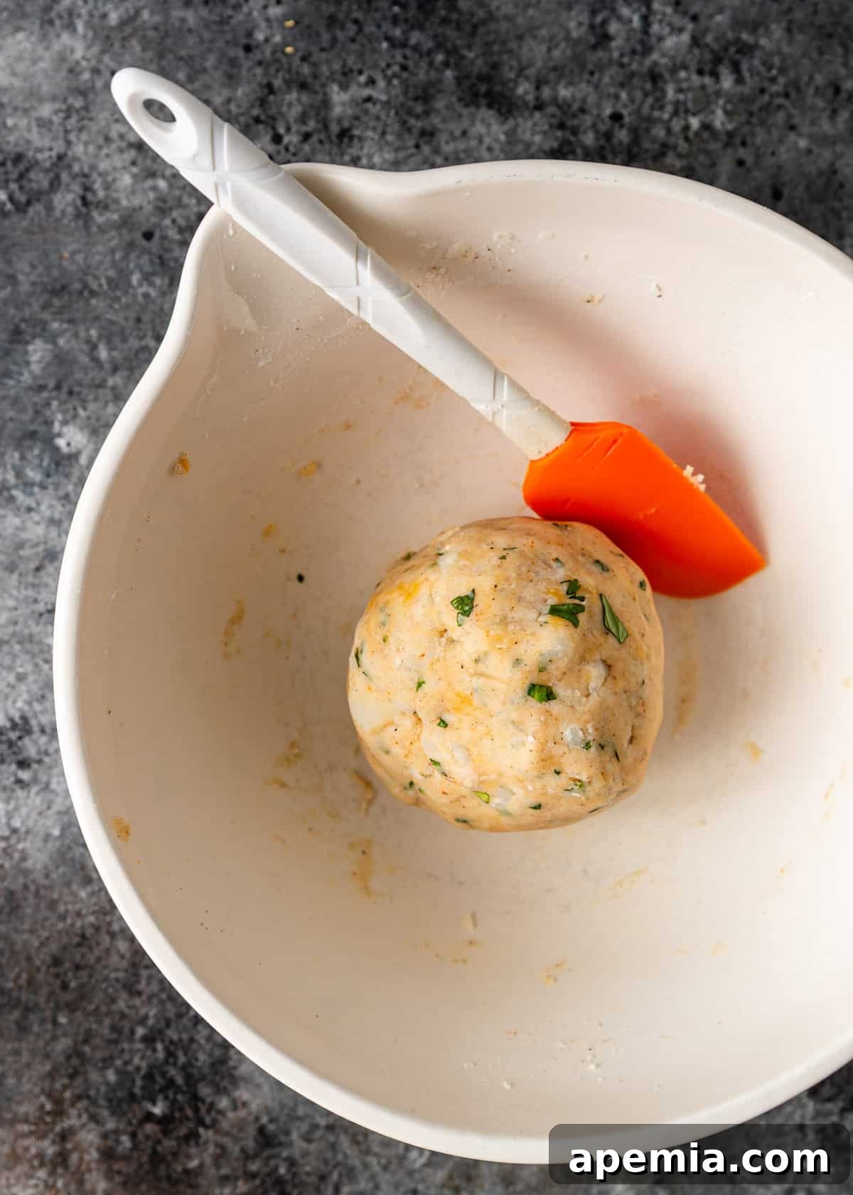 Overhead view of Aloo Tikki ingredients in a bowl after mixing in the form of a large ball