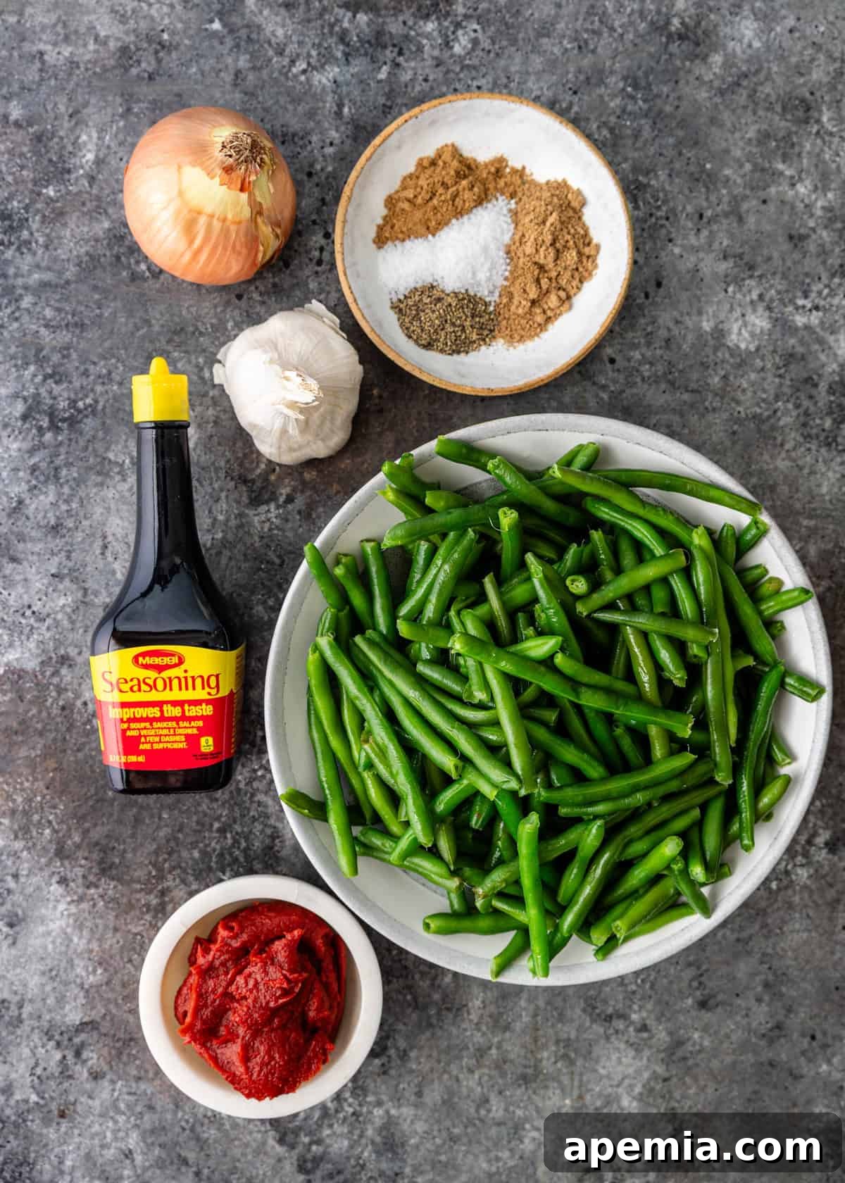 An overhead shot showcasing all the fresh, vibrant ingredients neatly laid out and ready for preparing the delicious Egyptian green bean stew recipe.