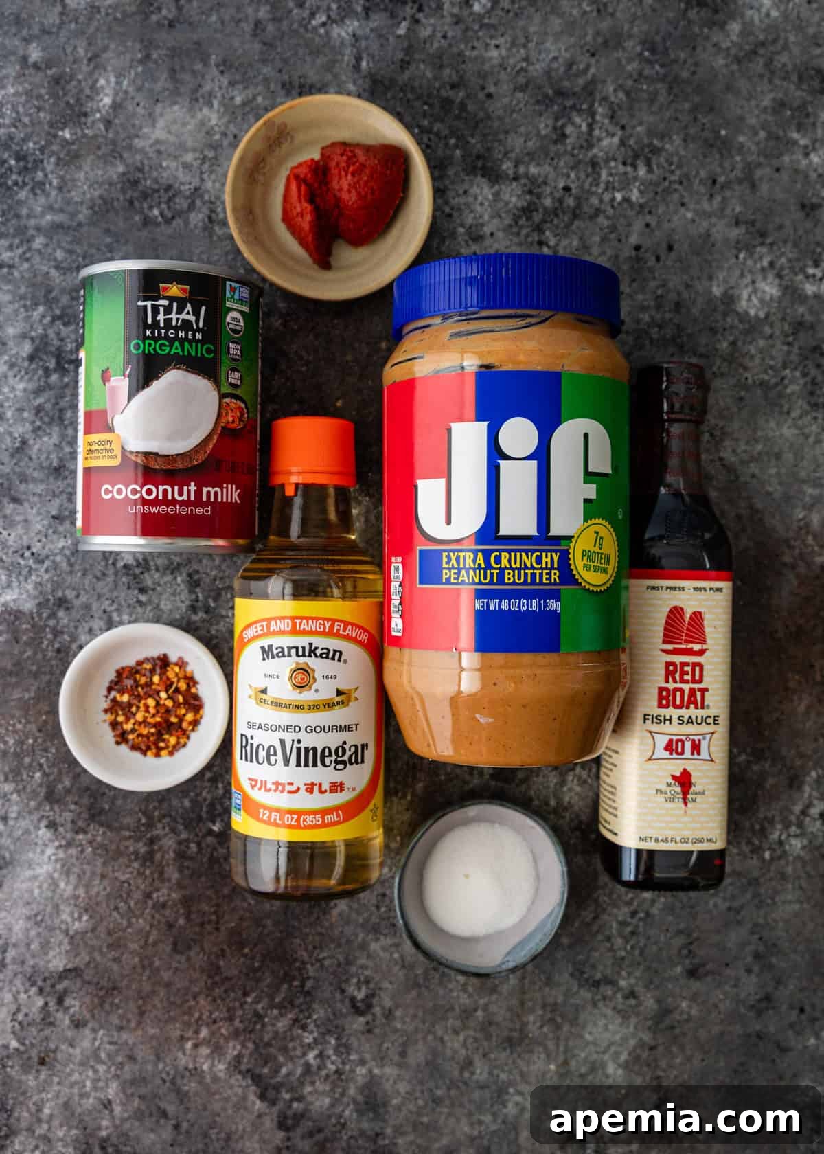 An overhead view showcasing all the fresh and vibrant ingredients meticulously arranged for preparing my signature Thai peanut sauce recipe.