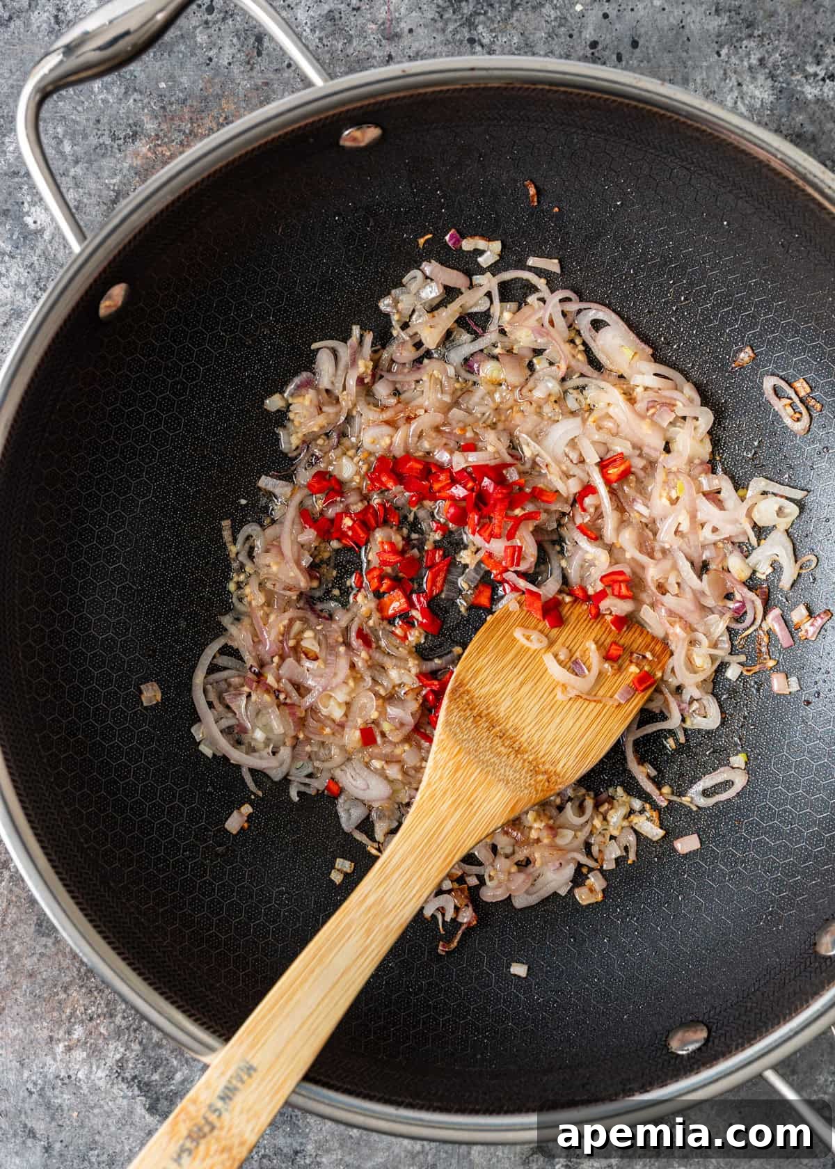 overhead process shot: sautéing the aromatics in a wok