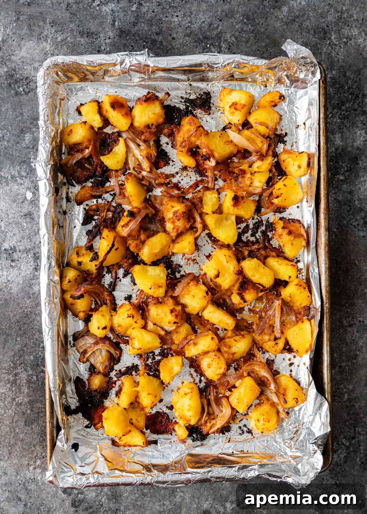 overhead process shot: roasted miso potatoes on a baking sheet
