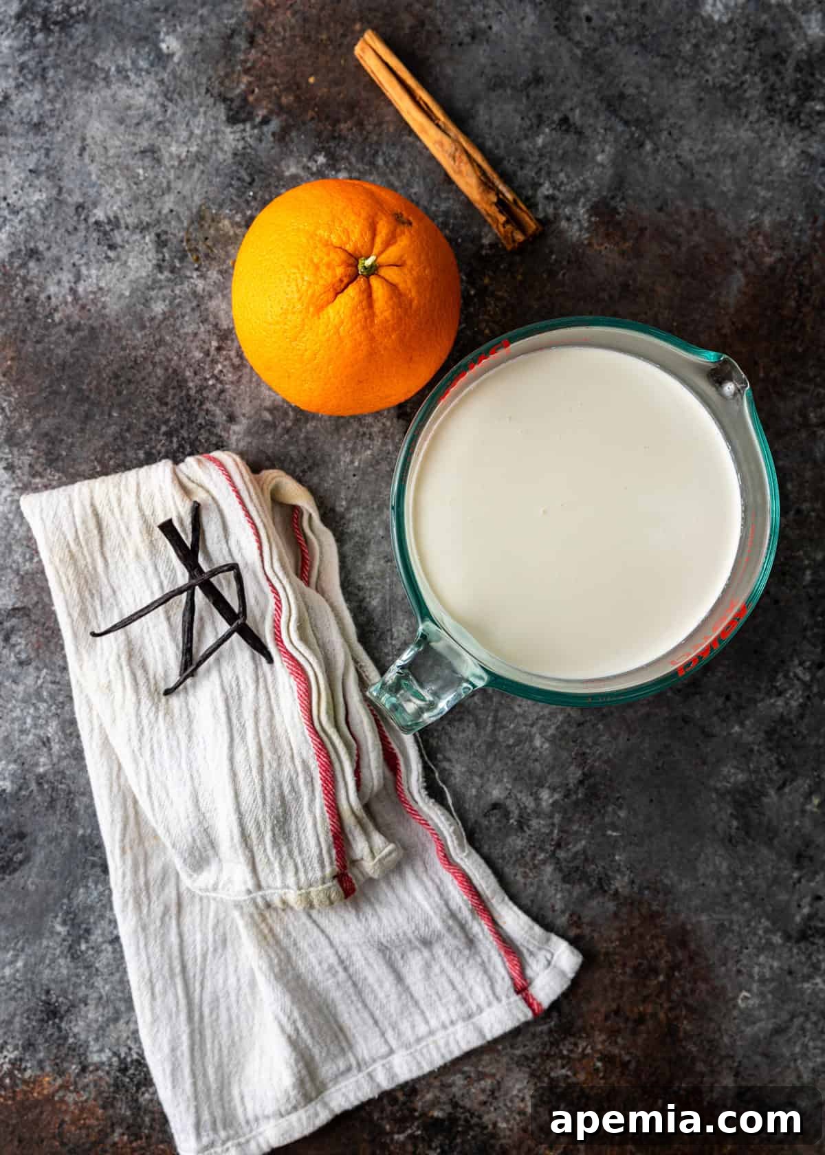 overhead: milk, orange, cinnamon, and vanilla needed to make Spanish creme brulee