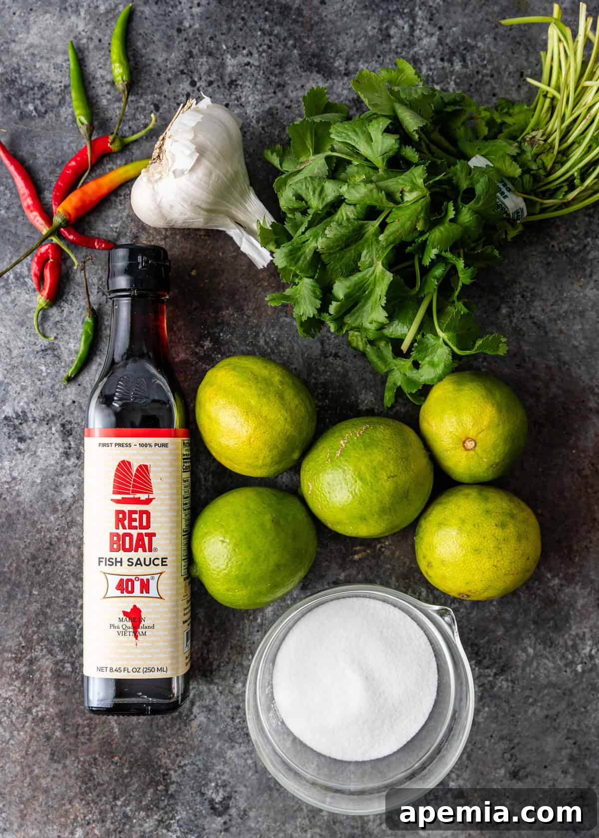 overhead: fresh ingredients laid out on a wooden board, ready to make dipping sauce