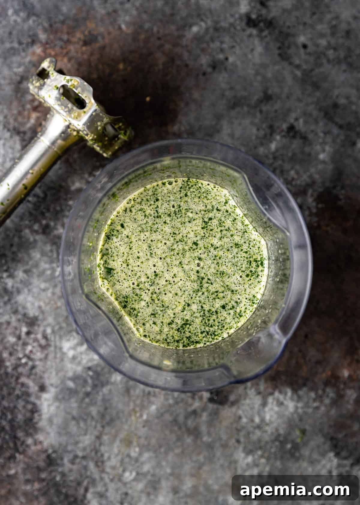 overhead: thai dipping sauce after blending, smooth and vibrant in a glass bowl