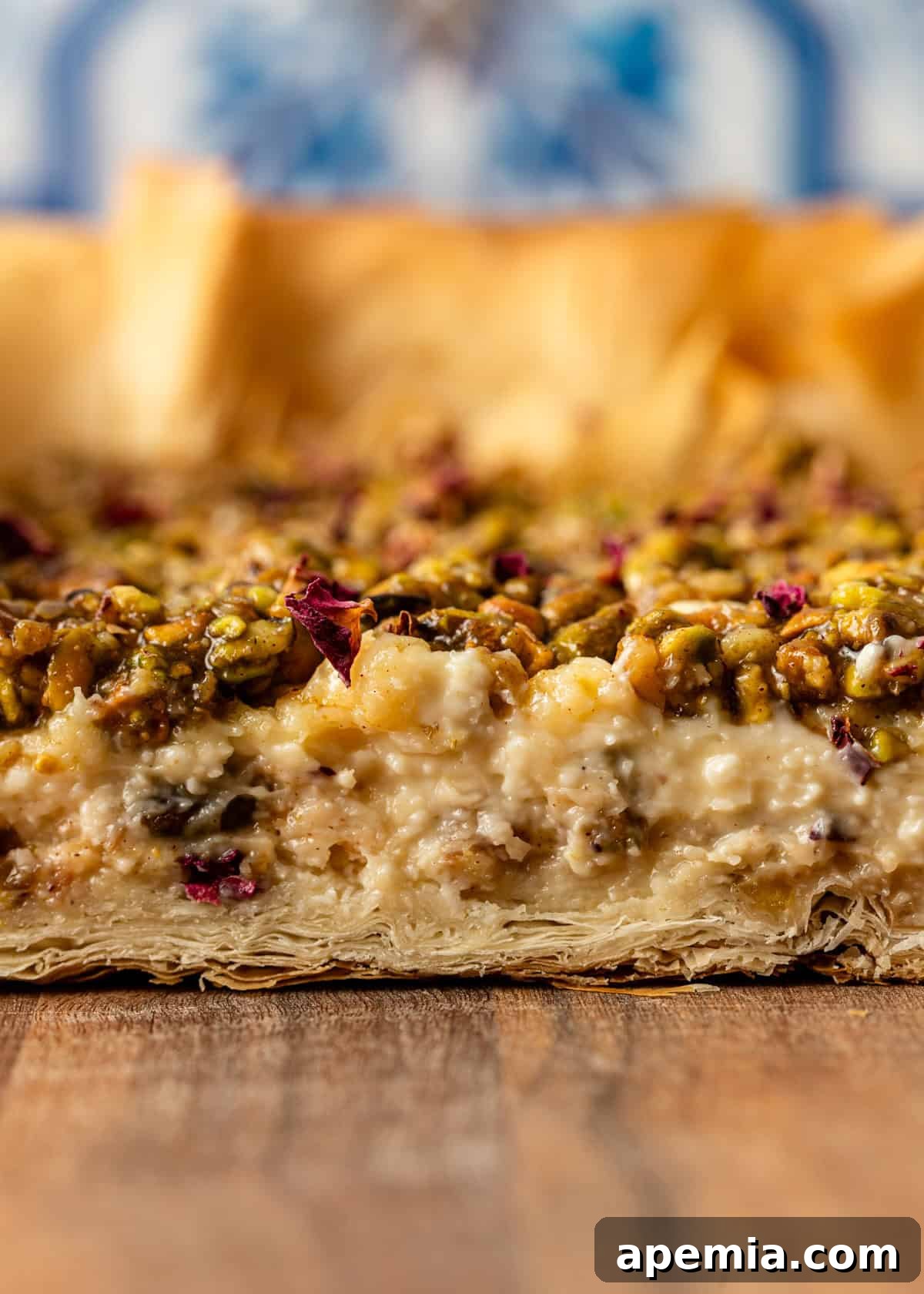 closeup side view: showing all the layers of Baklava Cheesecake