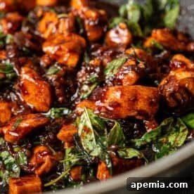 A vibrant and appetizing image of freshly prepared Thai Basil Chicken, ready to be served.
