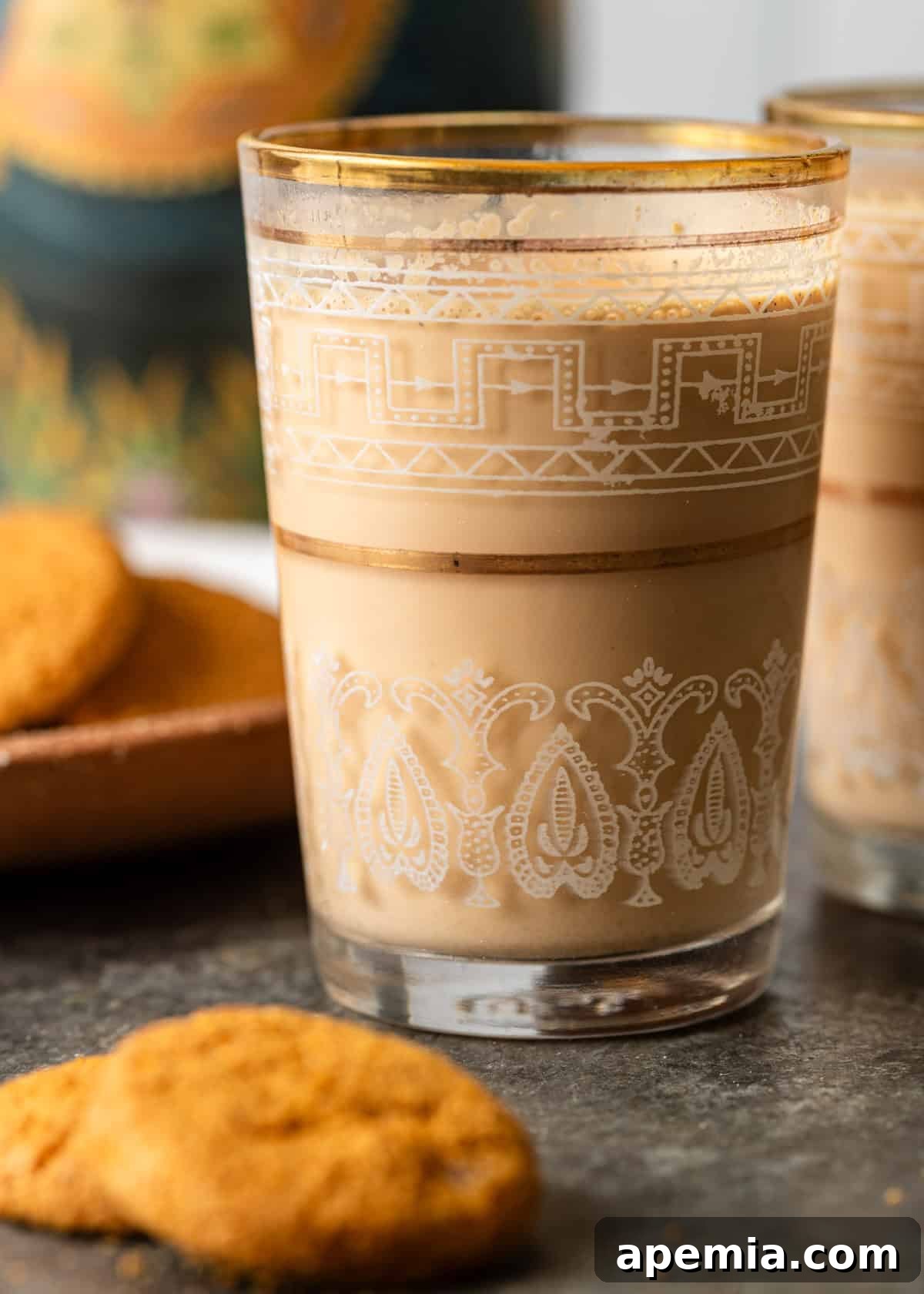 closeup side view: glass of chai latte