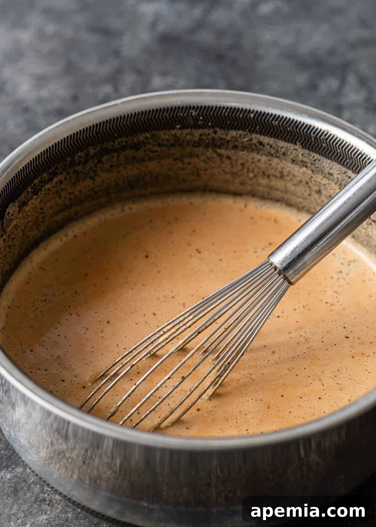 overhead process shot: ingredients to make chai tea latte in saucepan