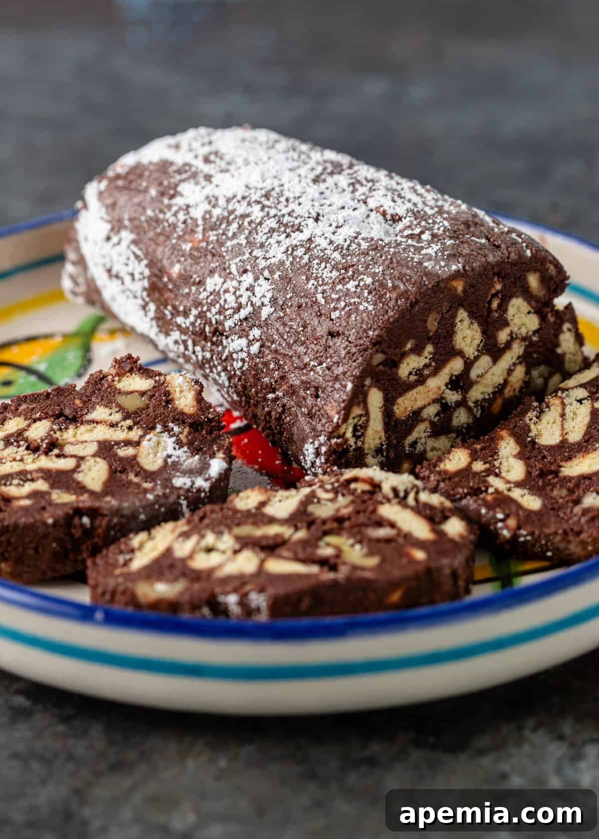 overhead: greek no-bake dessert on colorful plate with 3 sliced pieces