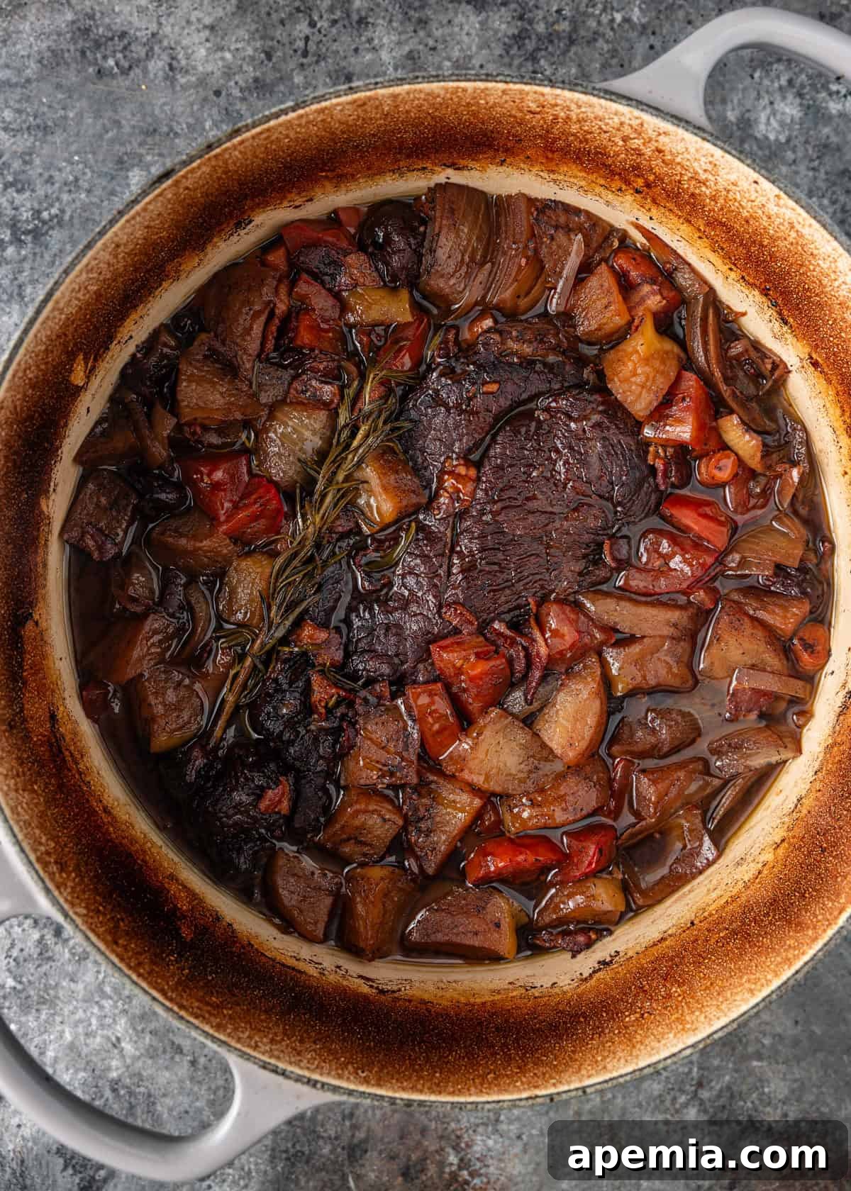 overhead: oil and chopped vegetables added to roast in dutch oven