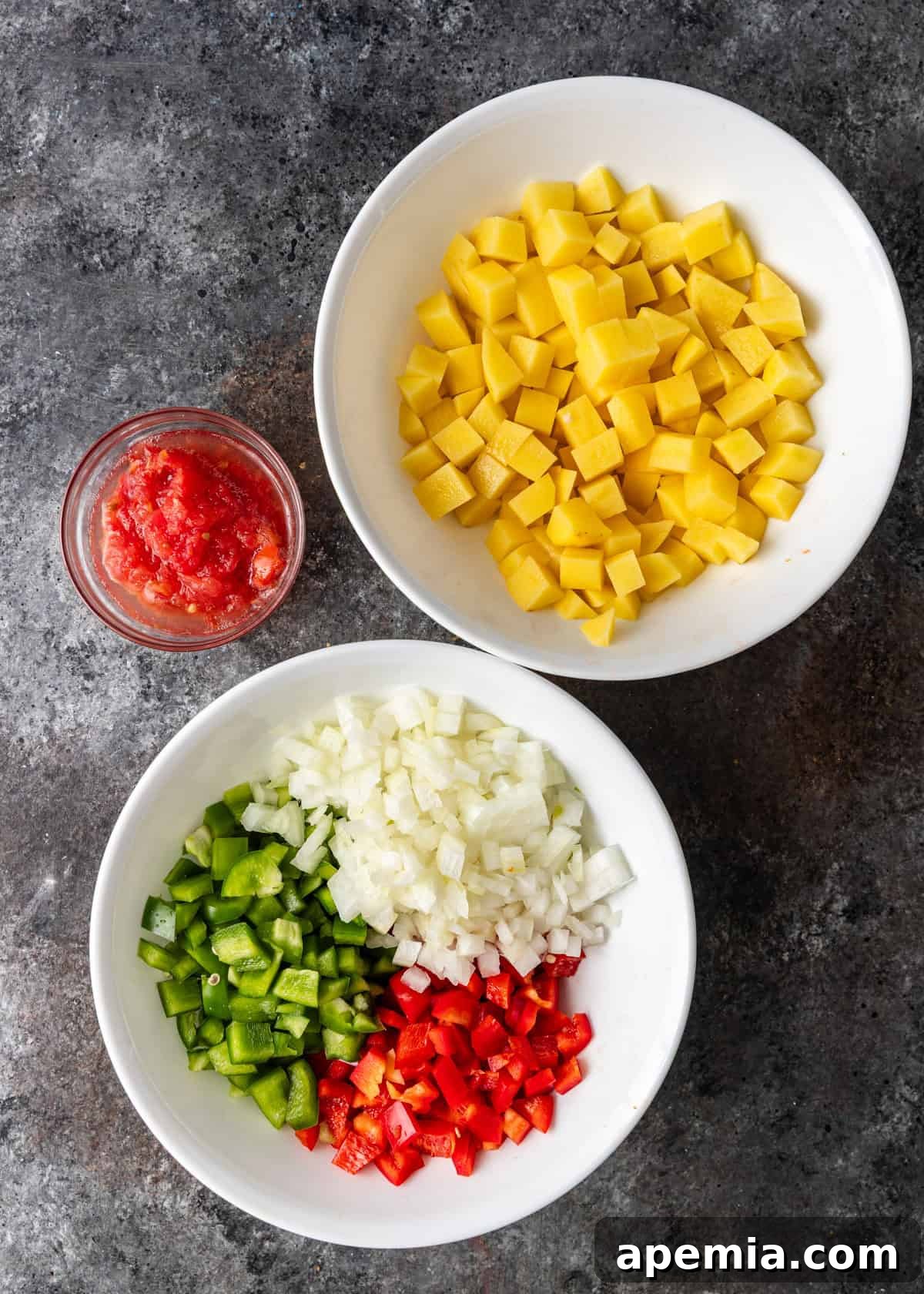 overhead process shot: 3 bowls with ingredients to make chickpea stew