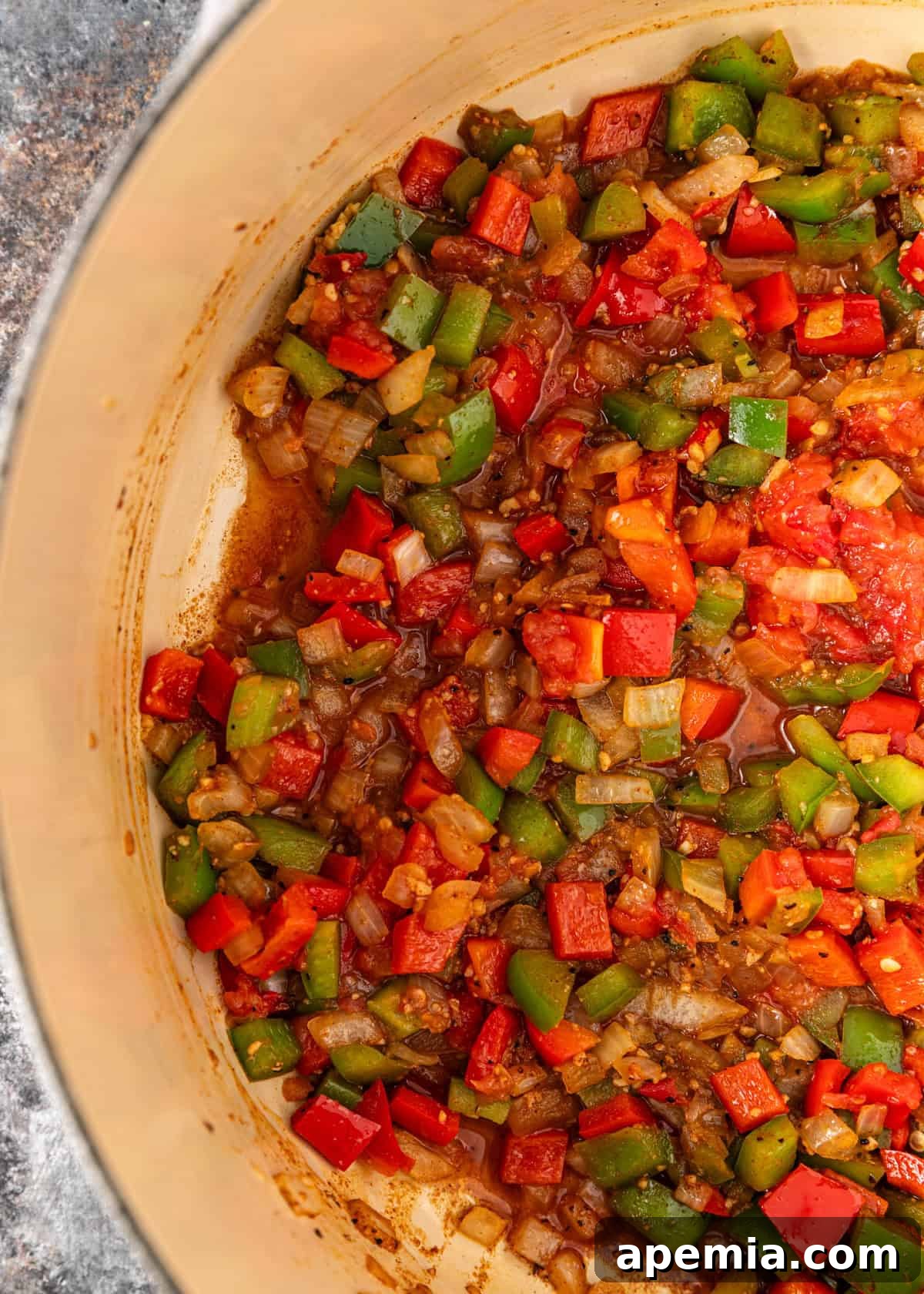overhead process shot: cut up cooked ingredients in pot