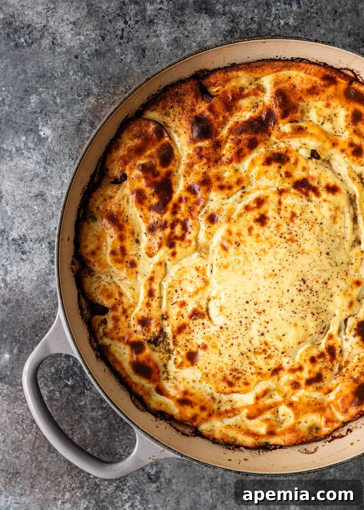 closeup overhead: Baked Lamb with Rice in skillet on counter